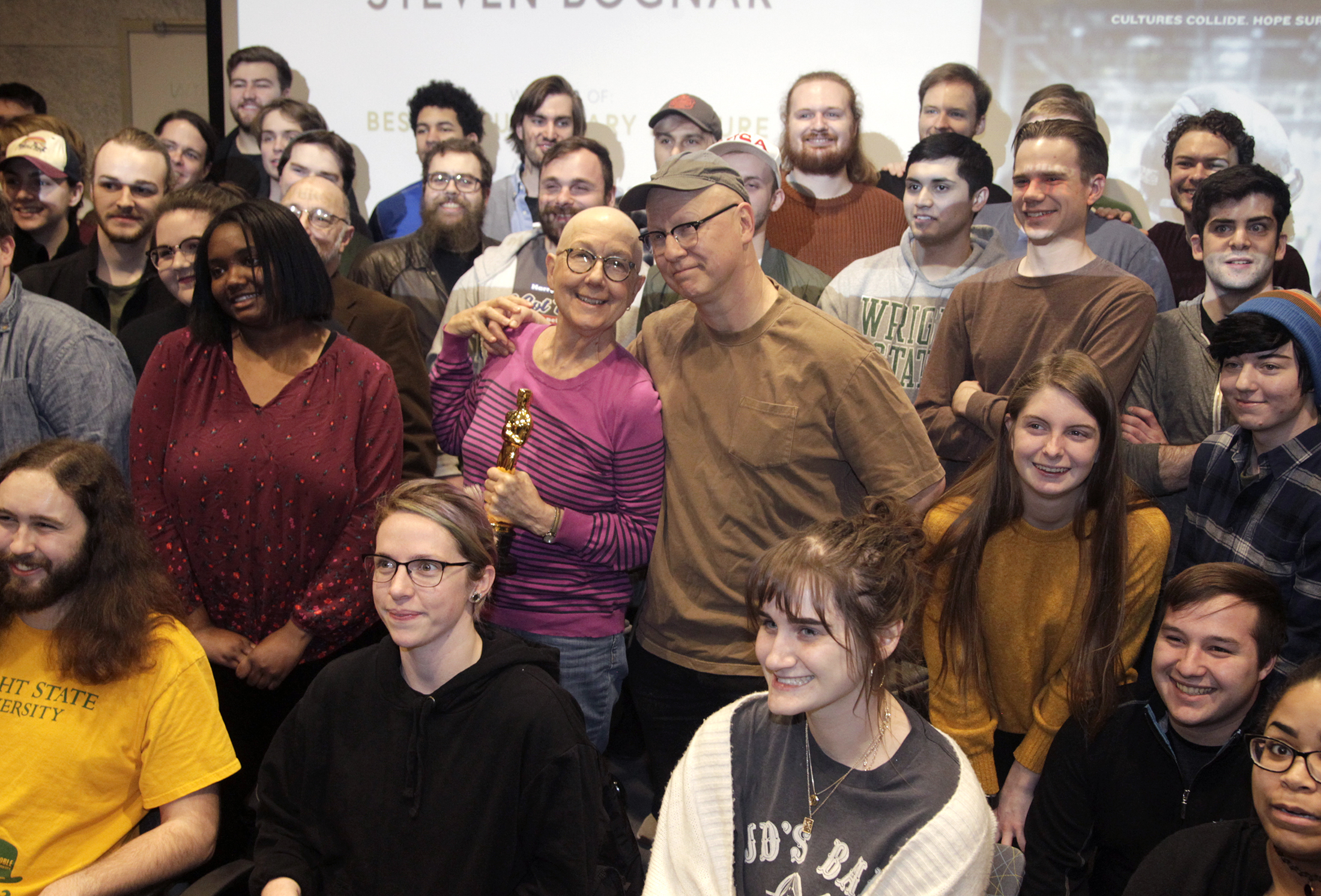 Julia Reichert and Steven Bognar, who won an Oscar in the documentary feature category for âAmerican Factory,â returned to Wright State University Thursday to speak with students in the Department of Theatre, Dance and Motion Pictures. Reichert is a professor emeritus at WSU and Bognar is an alumnus and former motion pictures faculty member. The couple brought their Oscar statuettes for the students to pass around and shared their documentary film making process. âAmerican Factoryâ follows the creation of the Chinese-owned automotive glass-factory Fuyao Glass America in the same building that had once housed a General Motors assembly operation in Moraine. LISA POWELL / STAFF