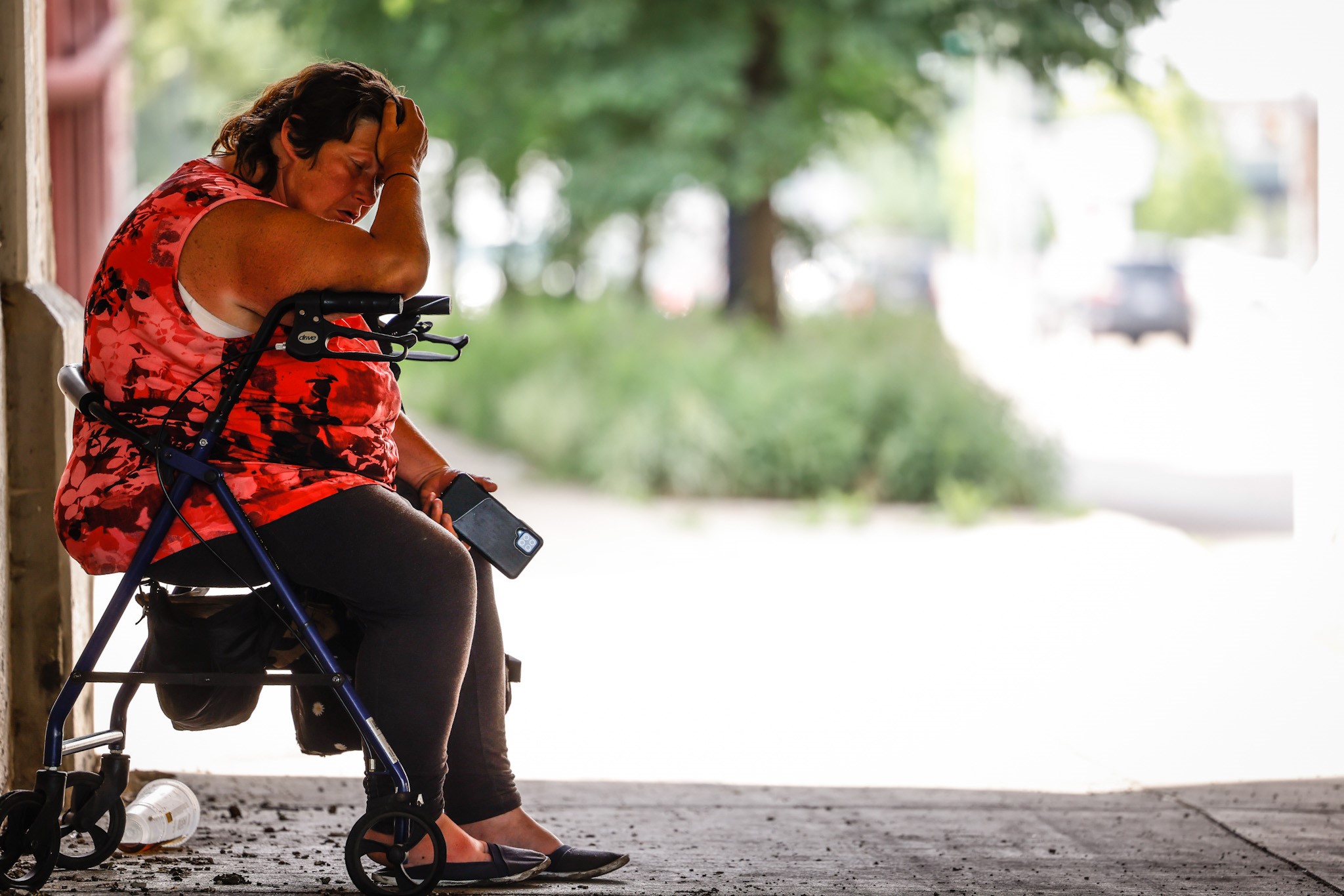 Dayton resident Sherry Griffin seeks shelter from the heat under the railroad trestle on South Patterson Blvd. on Monday, June 13, 2022. Temperatures are expected to soar into the 90s most of the week with heat indexes in the 100. JIM NOELKER/STAFF