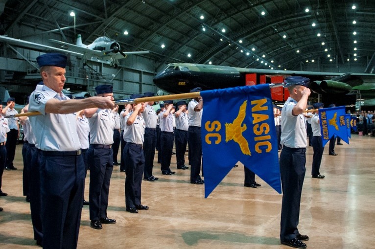 Members of the National Air and Space Intelligence Center stand render their first salute to Col. Ariel G. Batungbacal, who now leads the Air Force’s primary source for foreign air and space intelligence. U.S. Air Force photo / Staff Sgt. Samuel Earick