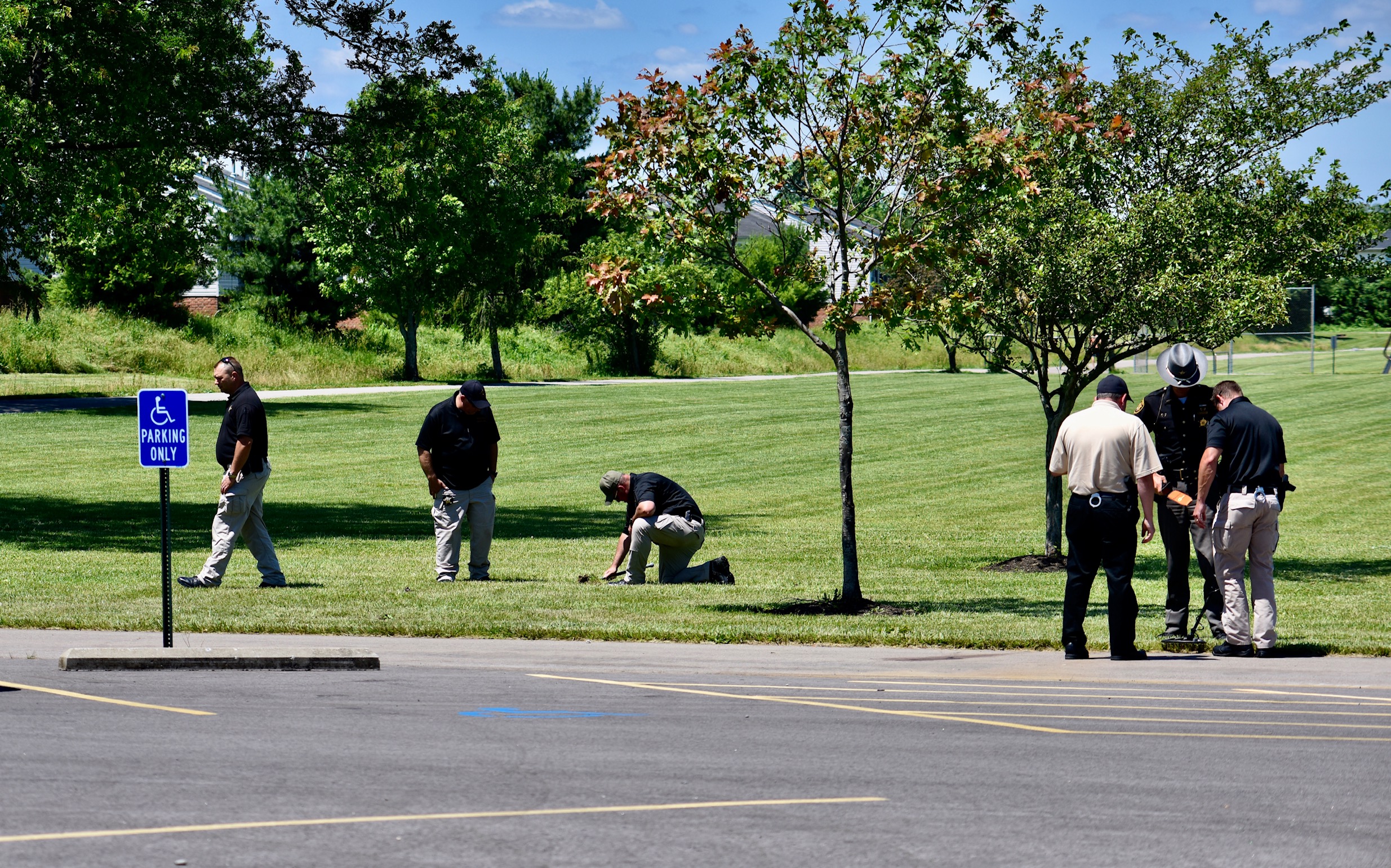 Investigators search Liberty Park in Liberty Twp. for evidence after a fatal shooting there on Wednesday night, June 10, 2020. NICK GRAHAM / STAFF