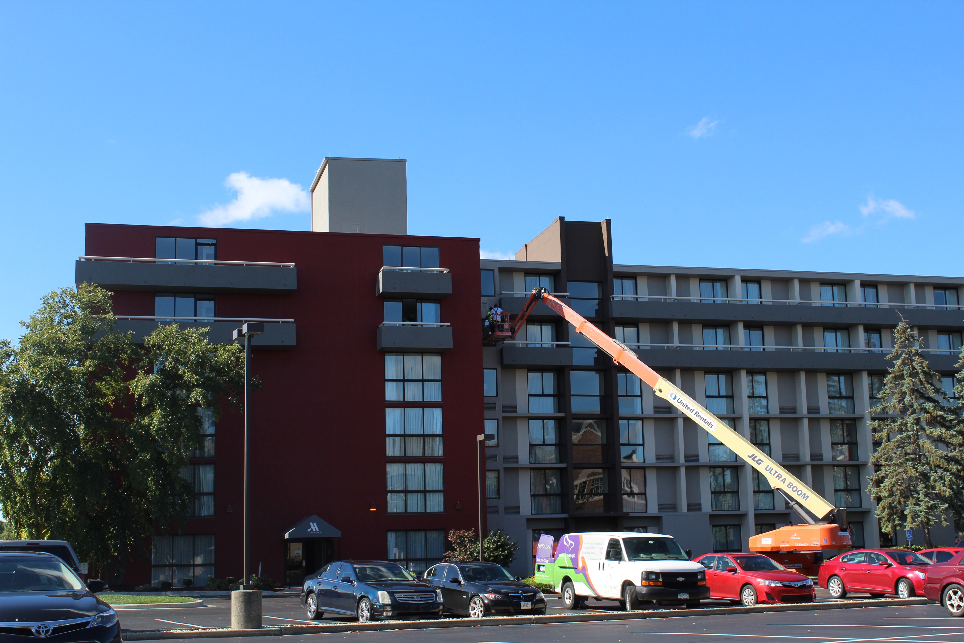 Crews work on the outside of the Marriott at the University of Dayton hotel. CORNELIUS FROLIK / STAFF