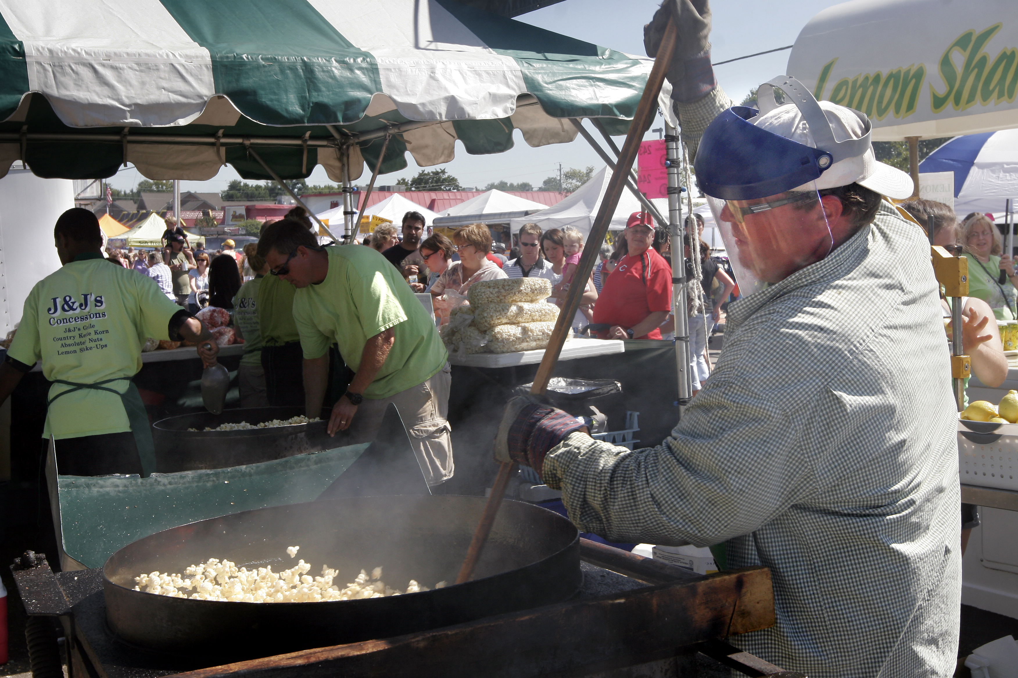 Scott Jenkins stirs up a batch of Kettle Corn for J & J's Concessions at the Beavercreek Popcorn Festival Sunday, Sept. 13.