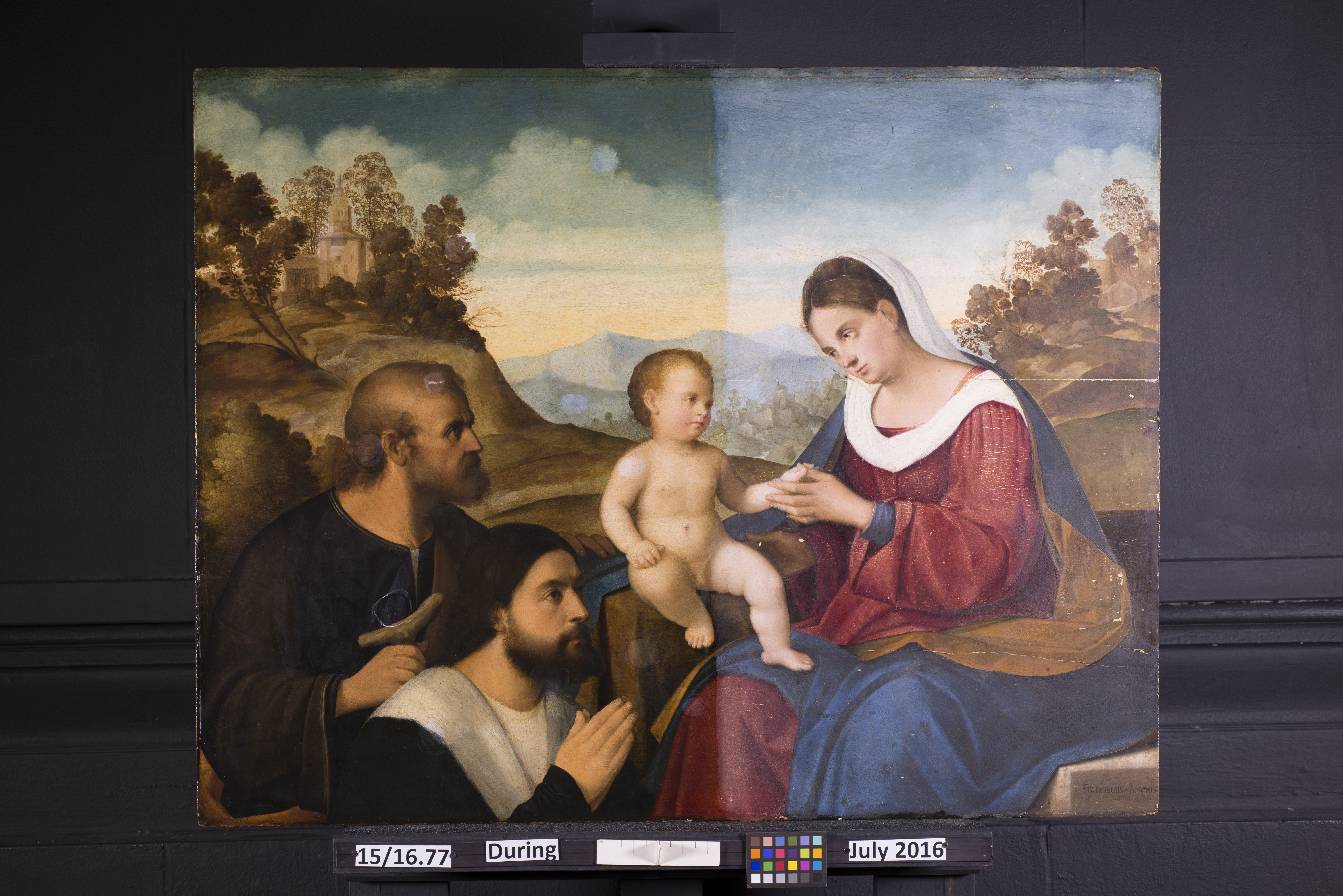Pier Francesco Bissolo’s "The Holy Family with a Donor in a Landscape" as it looked during the conservation process. CONTRIBUTED