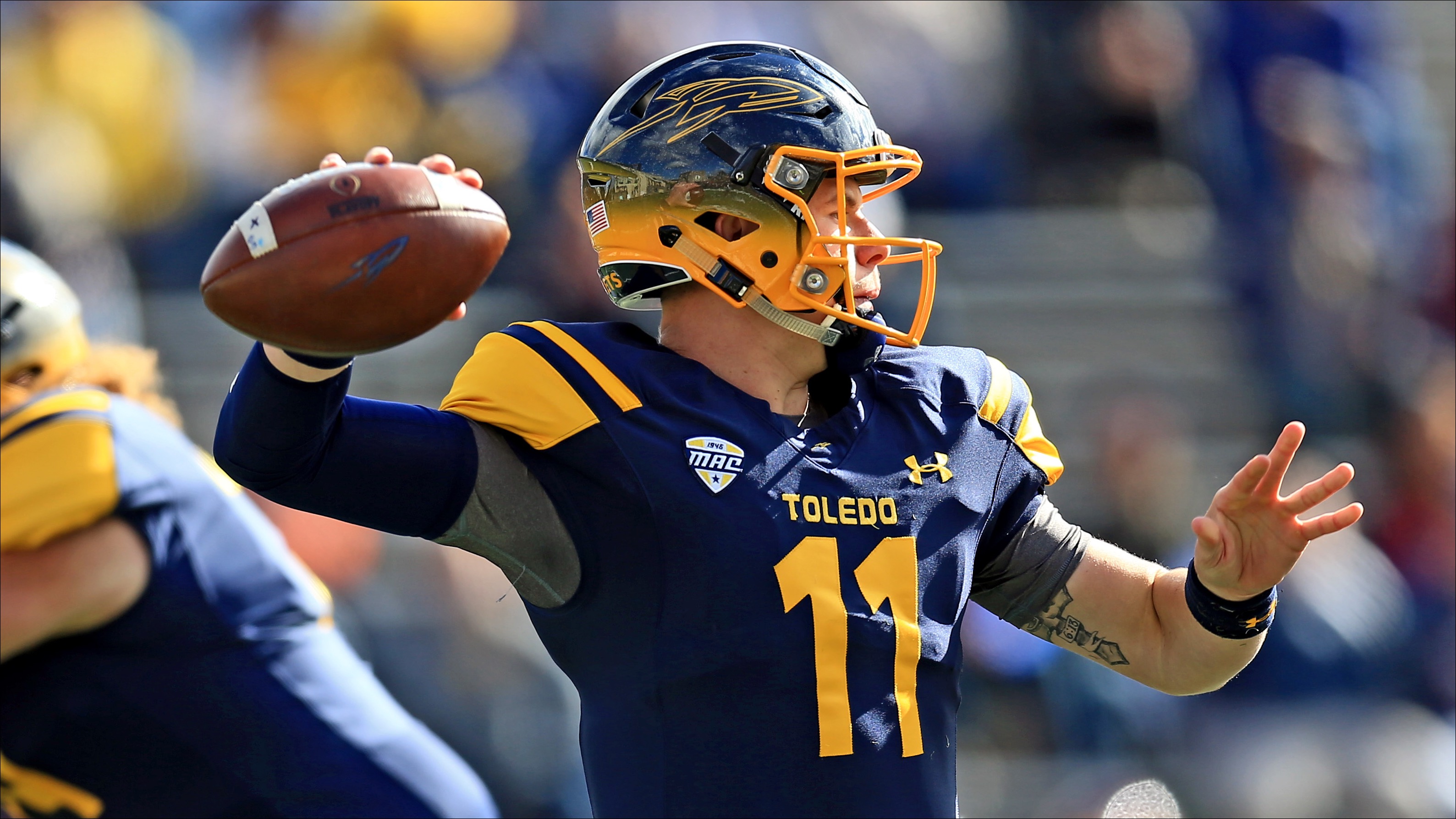 TOLEDO, OH - OCTOBER 22: Quarterback Logan Woodside #11 of the Toledo Rockets throws a pass against Central Michigan Chippewas at Glass Bowl on October 22, 2016 in Toledo, Ohio. (Photo by Andrew Weber/Getty Images)