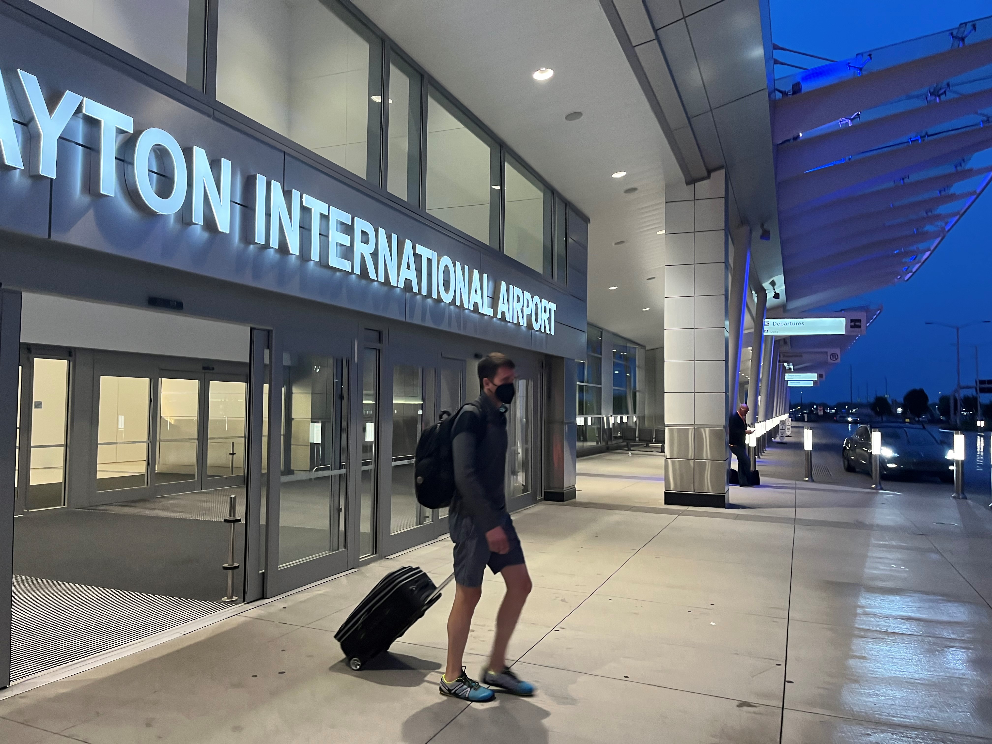A traveler leaving the Dayton International Airport. CORNELIUS FROLIK / STAFF