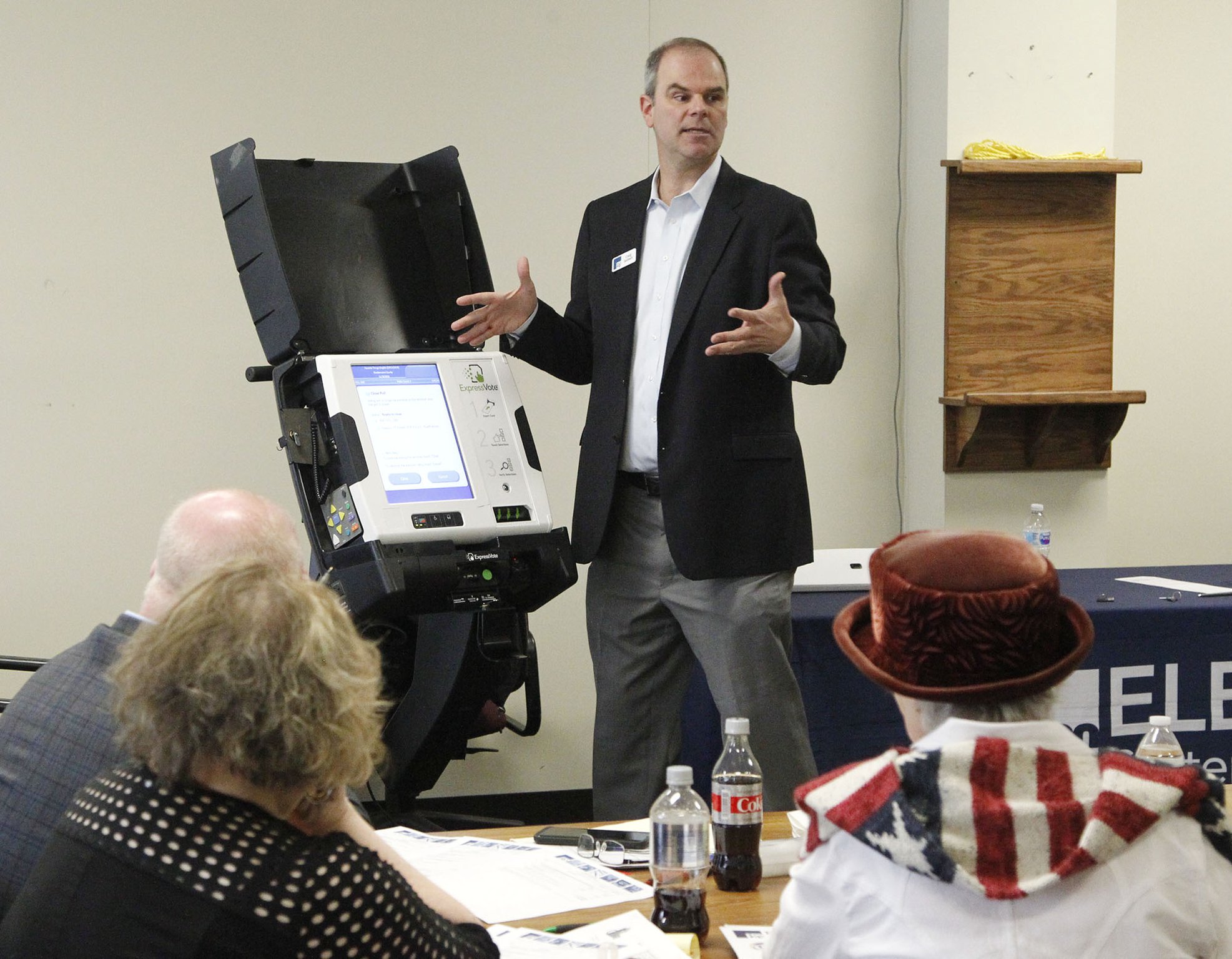 Craig Seibert, regional sales manager, from Election Systems & Software demonstrates a voting machine to the Greene County Board of Elections in Xenia. Dominion Voting Systems machines were demonstrated in a later session. TY GREENLEES / STAFF