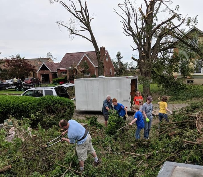 Friends and volunteers from the Oregon District worked to clear Robin and Chris Sassenberg's Hillsdale Avenue home of debris.