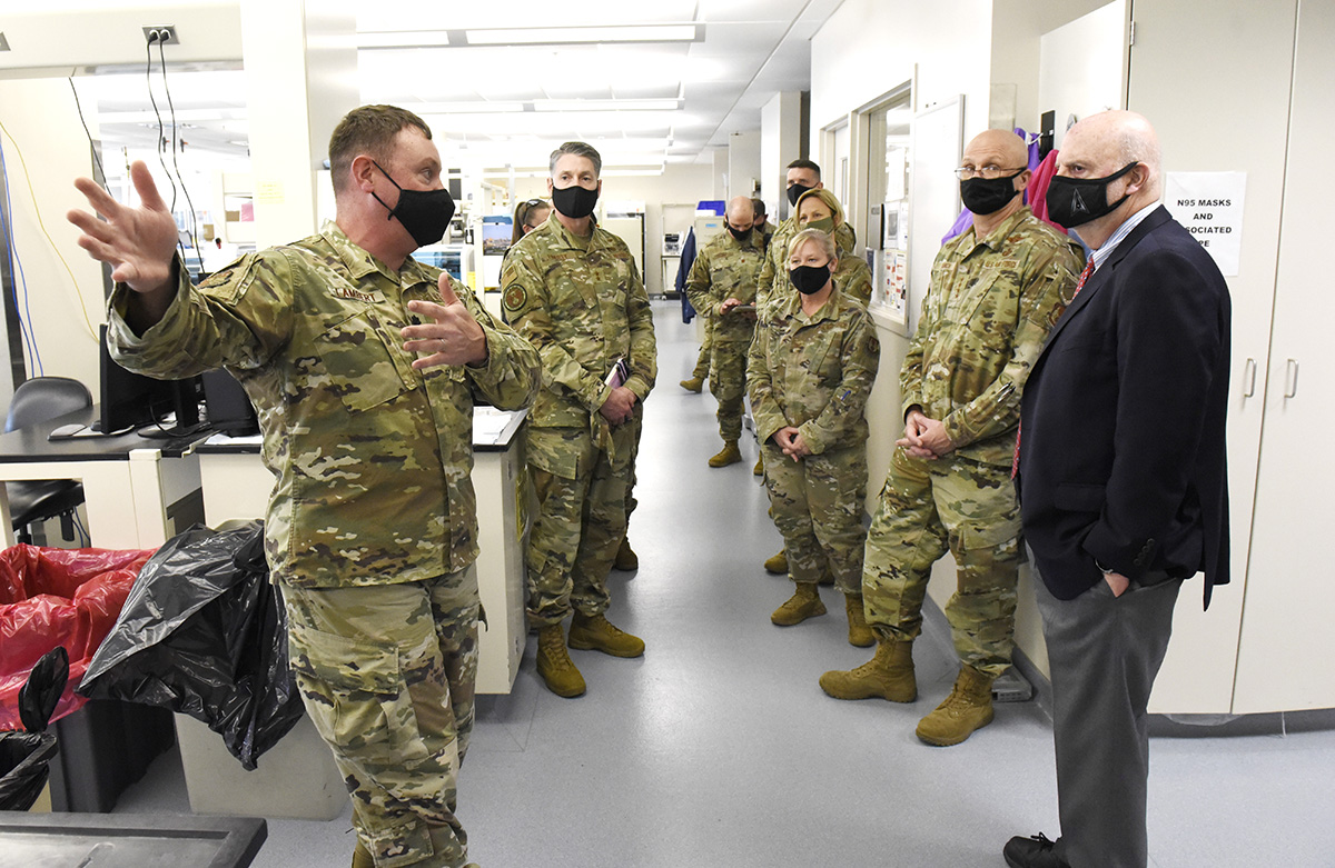 Acting Secretary of the Air Force John Roth, right, and Gen. Arnold W. Bunch Jr., commander, Air Force Materiel Command, listen to a presentation about the U.S. Air Force School of Aerospace Medicine Epidemiology Laboratory at Wright-Patterson Air Force Base, Ohio, March 23, 2021. The lab is responsible for analyzing a majority of the COVID-19 tests in the Air Force. Roth met with Air Force personnel and toured several facilities at the base including the National Air and Space Intelligence Center. U.S. AIR FORCE PHOTO/TY GREENLEES