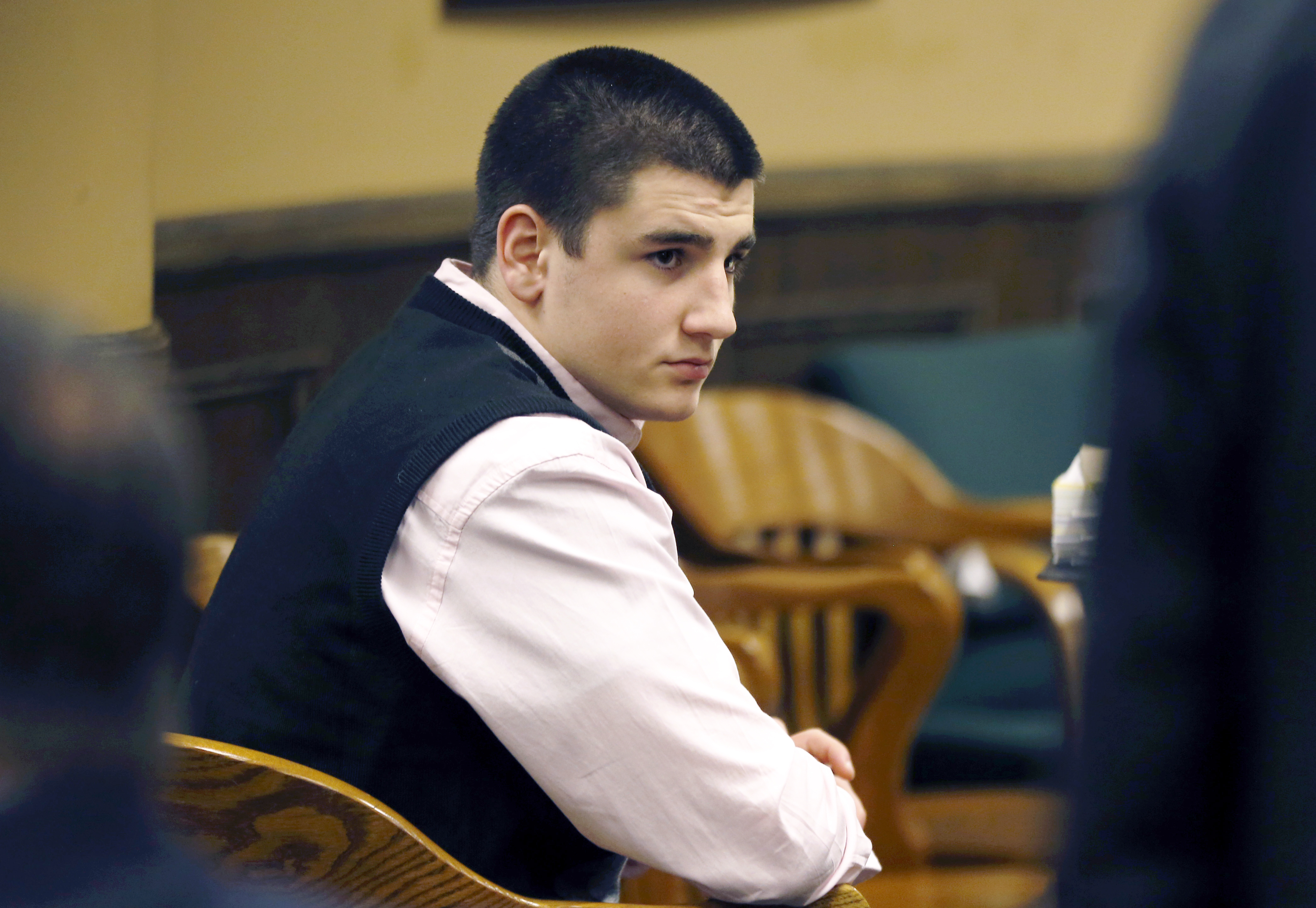 FILE - In a March 16, 2013 photo, Trent Mays, 17, sits in the court room during a break on the fourth day of the juvenile trial for he and co-defendant Ma’lik Richmond, 16, on rape charges in juvenile court in Steubenville, Ohio. Mays, convicted of raping a West Virginia girl following an alcohol-fueled party, was released from juvenile detention on Tuesday, Jan. 6, 2015.. (AP Photo/Keith Srakocic, Pool, File)