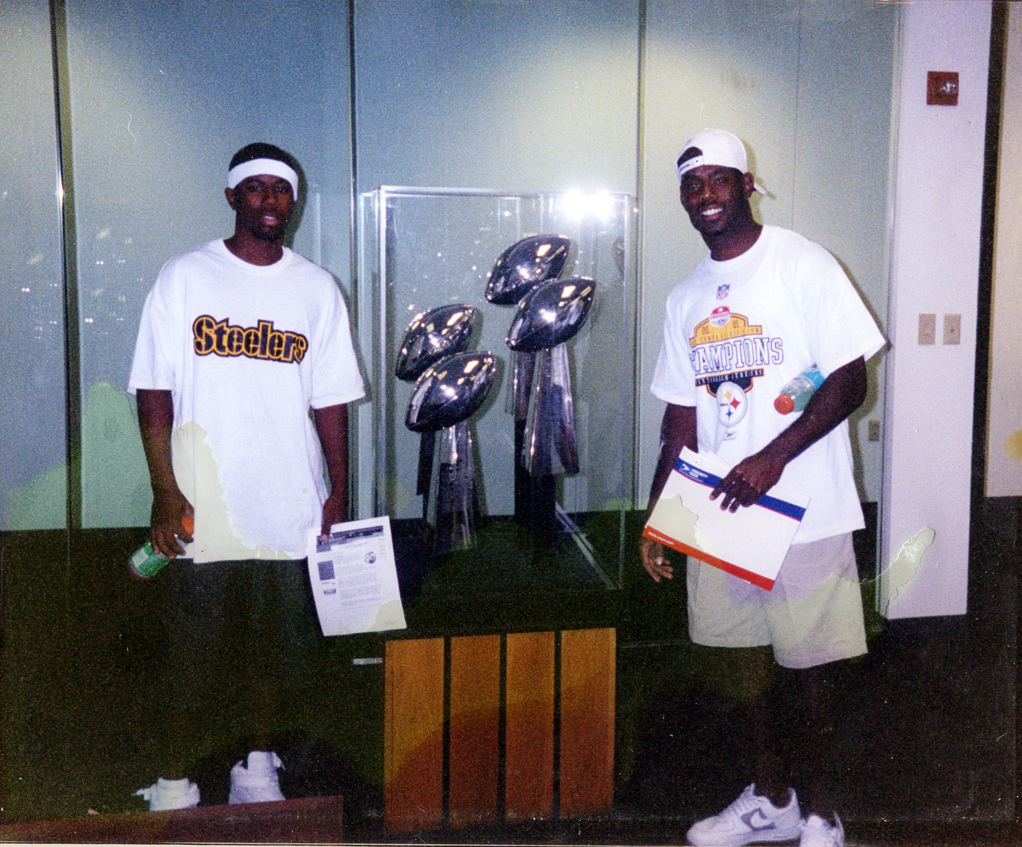 LaVar Glover (right) is picured here in this 2002 photo with his brother James Phillips (left). At the time this photo was taken, Glover had just signed with the Pittsburgh Steelers. The two are standing at the Steelers office in Pittsburgh, PA. Photo submitted by LaVar Glover.