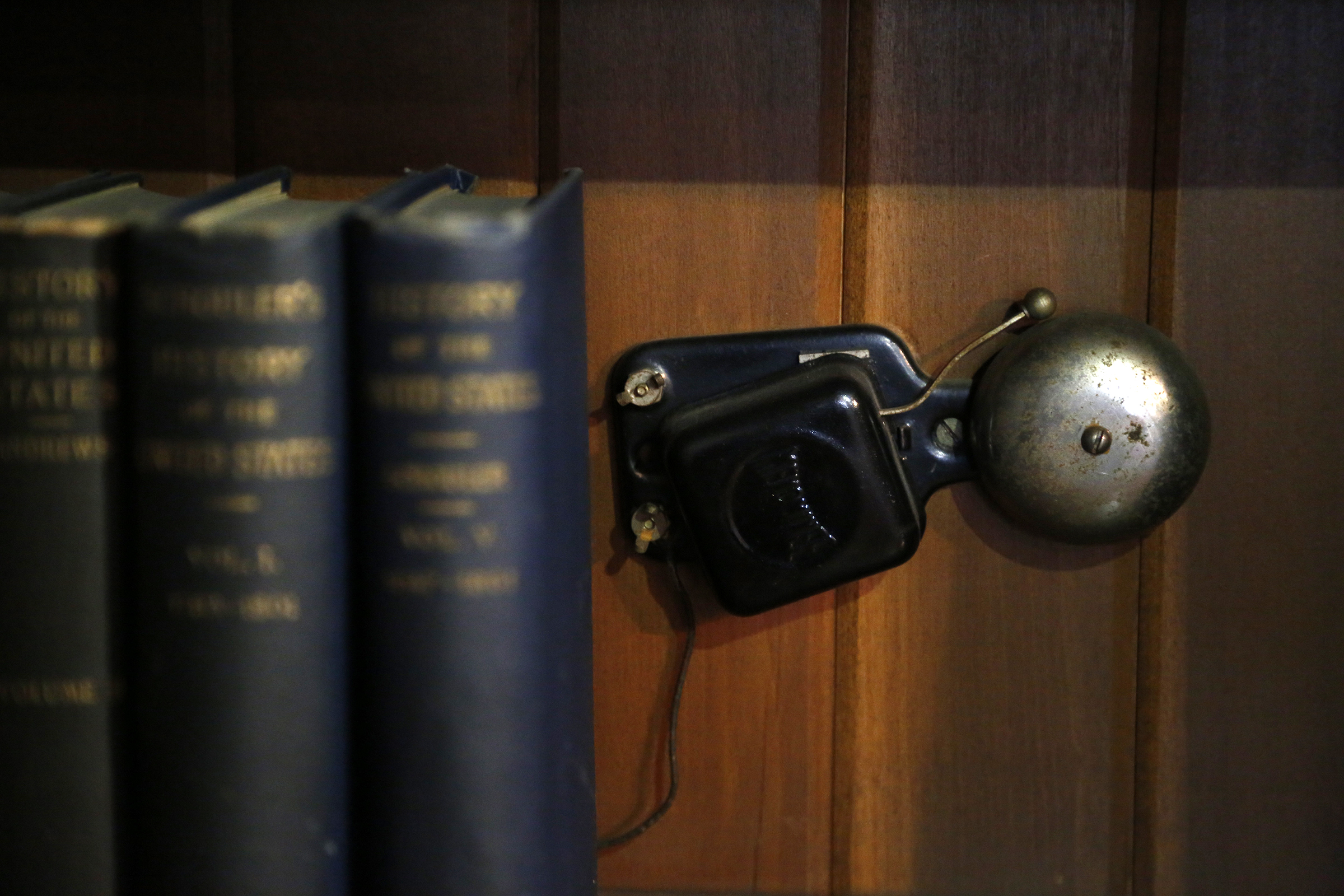 Tucked behind the volumes on the lowest book shelf in the library is the doorbell connected to the front door. Wright was tinkering with the buzzer connected to that bell earlier in the day he suffered his second heart attack, Jan. 27, 1948. LISA POWELL / STAFF