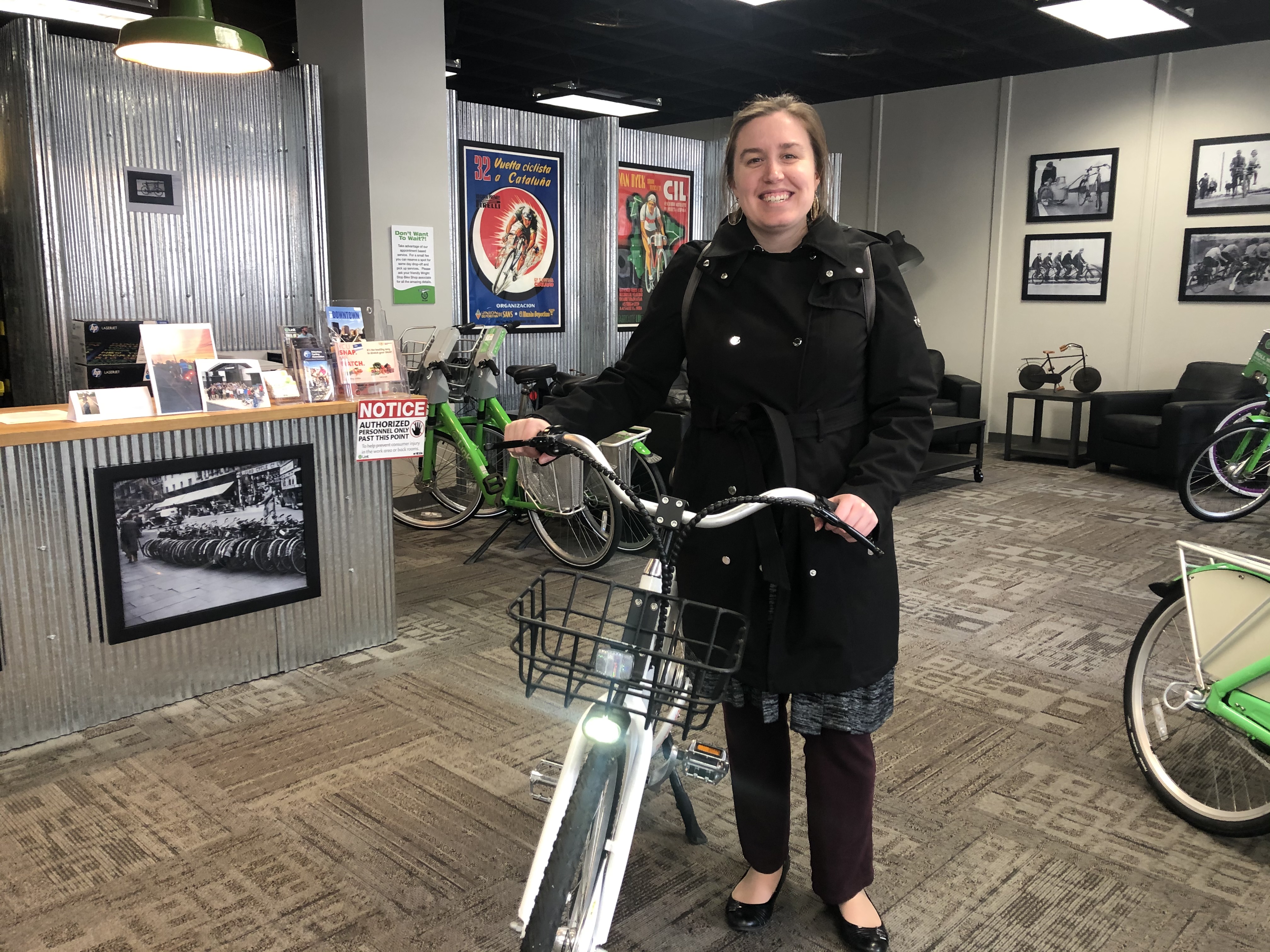 Laura Estandia, executive director of Bike Miami Valley, shows off one of Link Dayton Bike Share’s new electric bikes. eLink, the new electric-assisted bikes, will debut this spring. CORNELIUS FROLIK / STAFF
