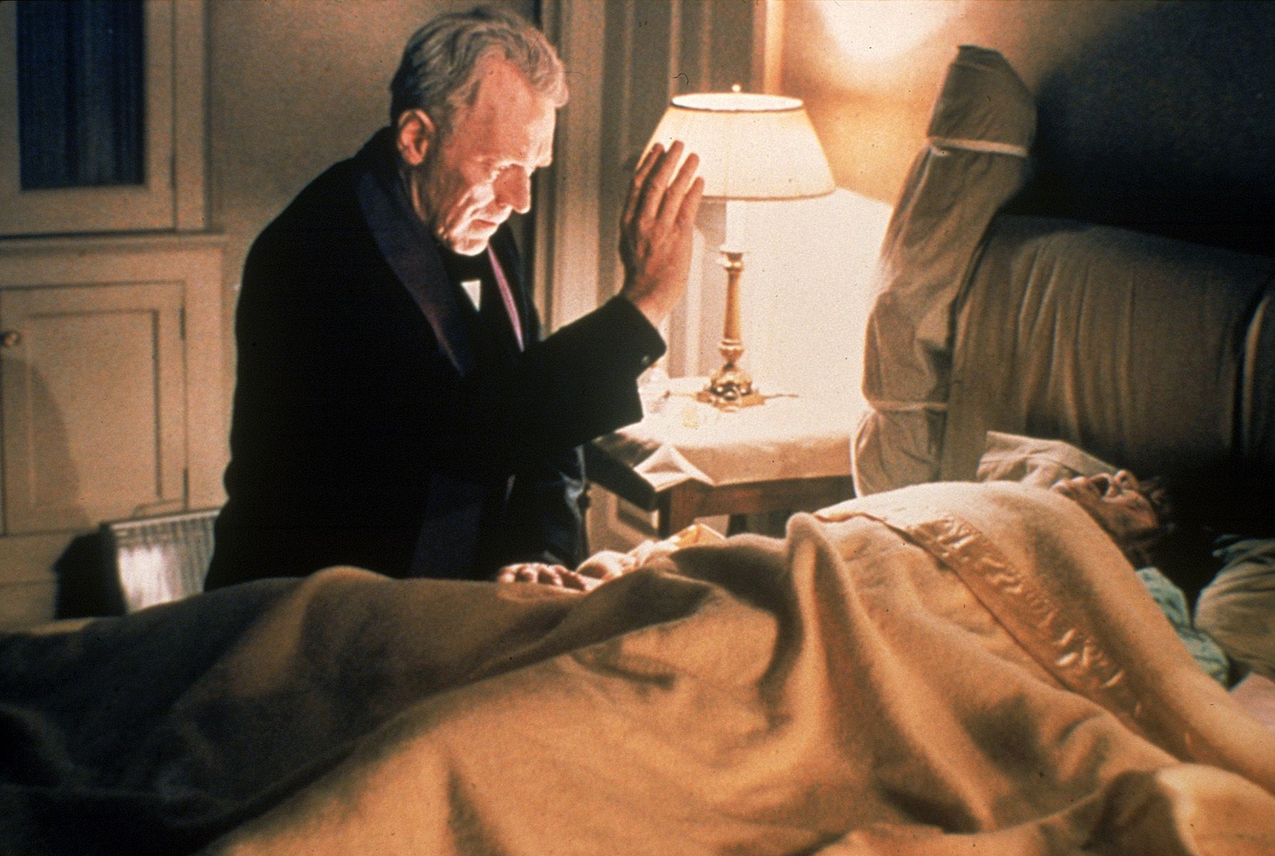 Father Merrin (Max von Sydow, left) attempts to rid young Regan (Linda Blair) of a demon in 1973's "The Exorcist."