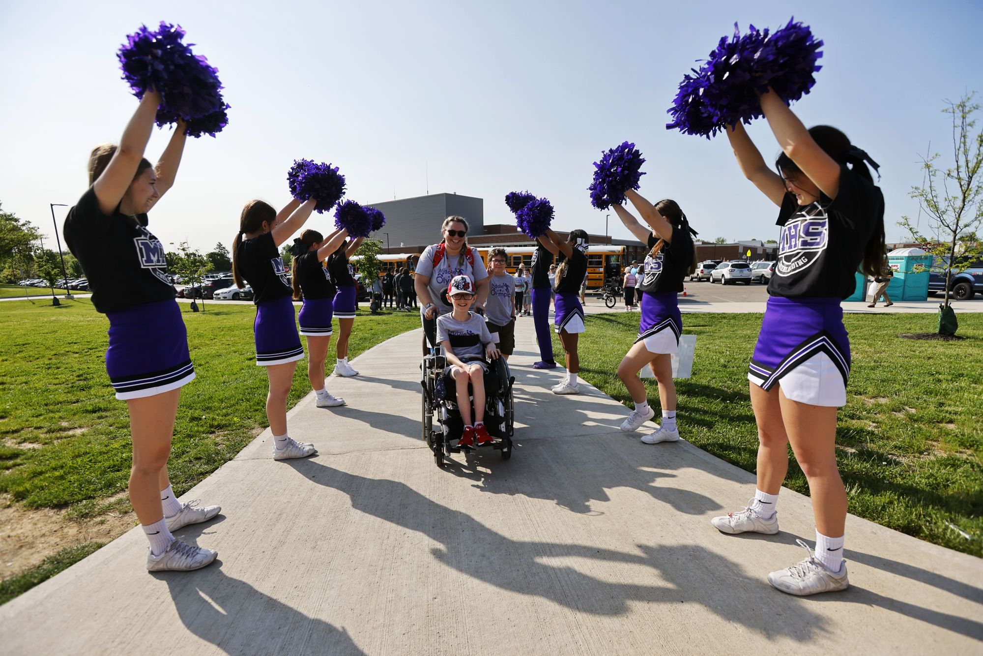 Cheerleaders greet Anderson Hayes, 10, and Amber Karkiewicz for Middie Olympics day Thursday, May 12, 2022 at Middletown High School. Community and student volunteers helped and students from all Middletown schools participated. NICK GRAHAM/STAFF
