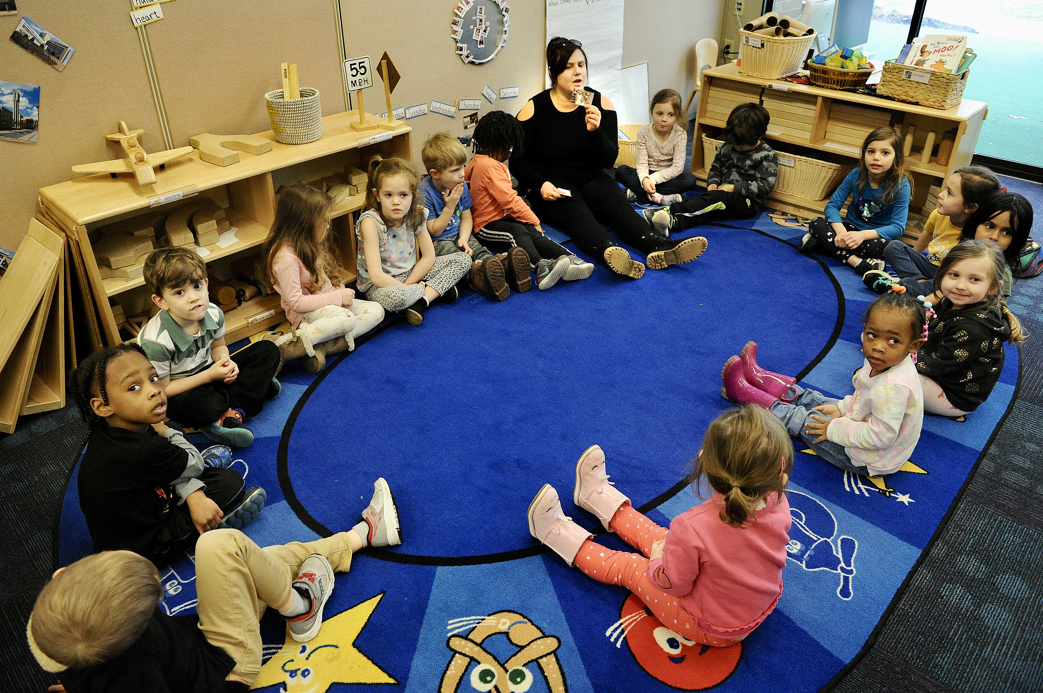 Kalyn George, a teacher at the Sinclair Mini University works with childern Wednesday March 9, 2022. MARSHALL GORBY\STAFF