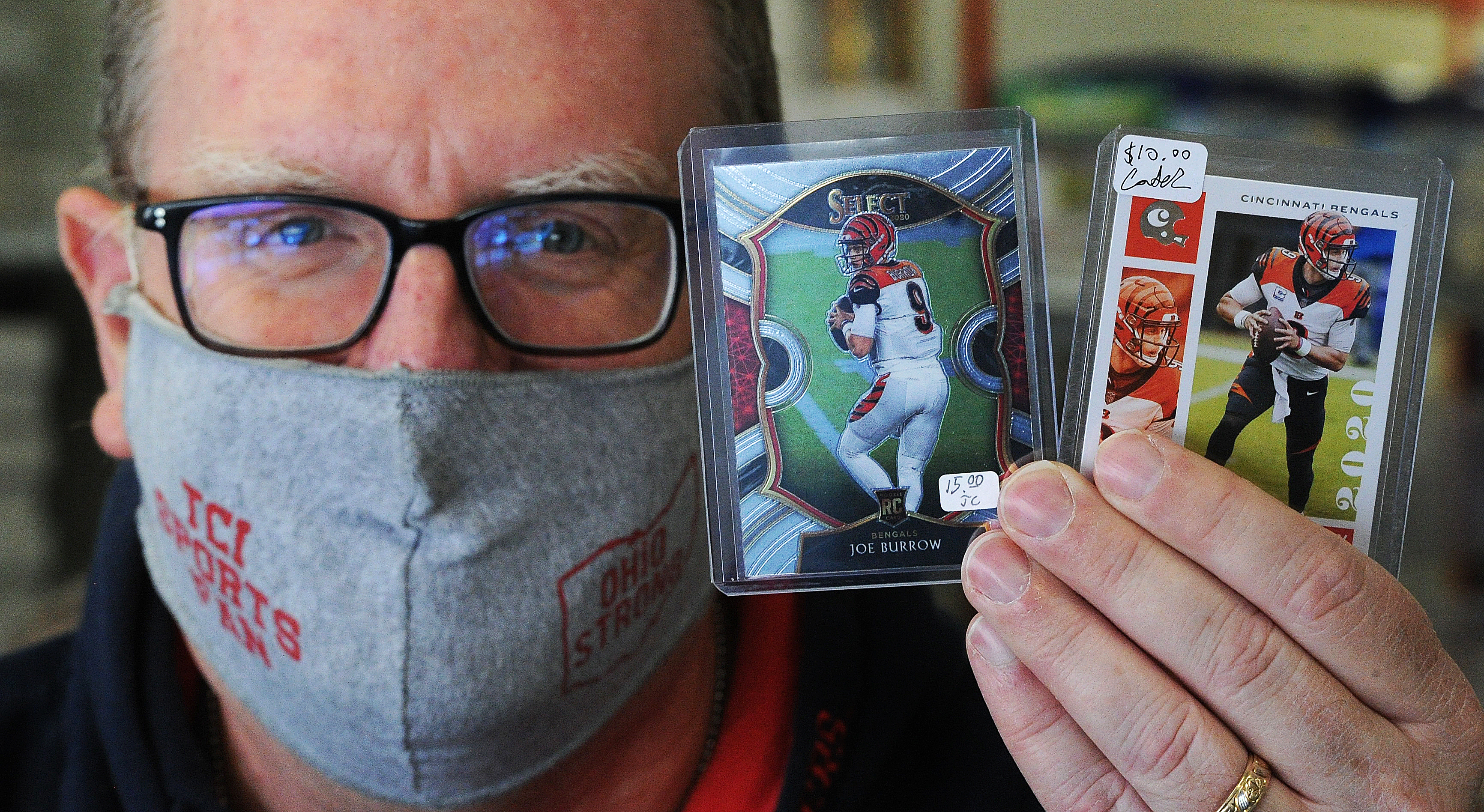 According to Terry Carter owner of TCI Sports Fan located at 3962 Linden Ave. Cincinnati Bengals quarterback, Joe Burrows rookie cards have doubled in price in the last week. MARSHALL GORBY\STAFF
