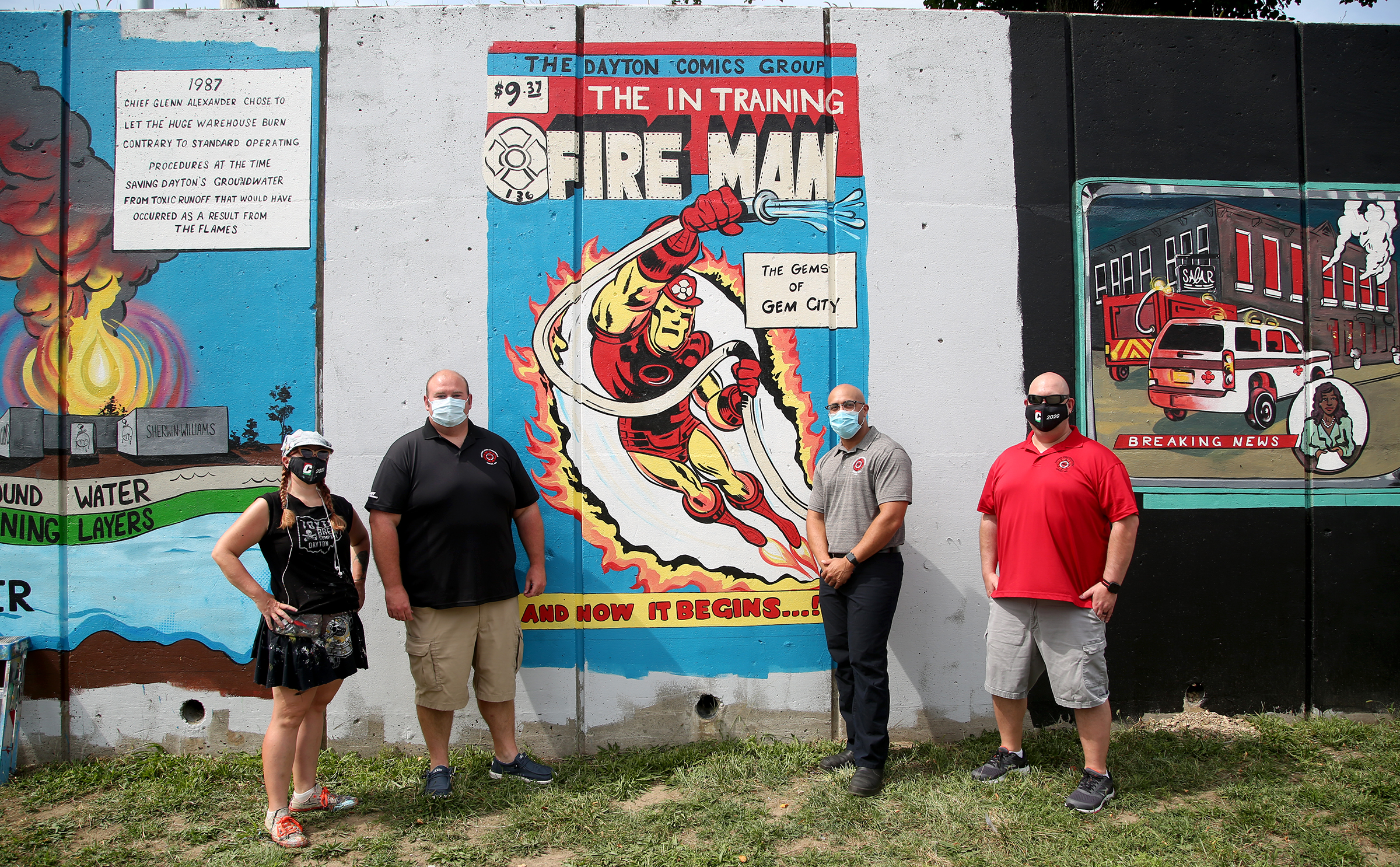 Tiffany Clark, a Dayton mural artist, (left) and members of Dayton Fire Fighters Local 136, Dennis Bristow, Marques Kincaid and Jim Burneka at a new mural on Buckeye Street commemorating the history of the Dayton Fire Departments. Dayton Fire Fighters Local 136 has teamed up with mural artist Tiffany Clark to create a 20-panel mural along Buckeye Street between Main and Warren Streets. The mural will tell the history of the Dayton Fire Department in vintage comic book style. LISA POWELL / STAFF