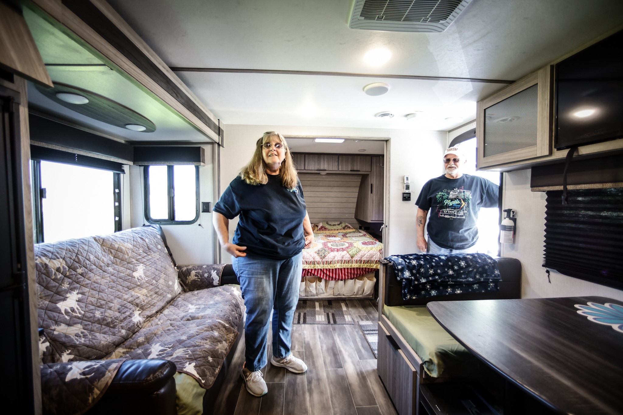 Marty and Donnie Vaughn show-off their second camper home. The couple travel camp 100 days out of the year. JIM NOELKER/STAFF