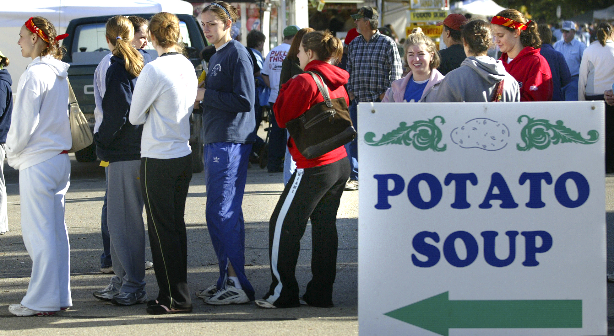 100706---The annual Potato Festival was held in Spring Valley with crafts, food, games and of course potatos. Runners in the Tater Trot line up for free potato soup after the race. All participants in the race got a free ticket either for soup or a baked potato. STAFF PHOTO BY BILL REINKE.