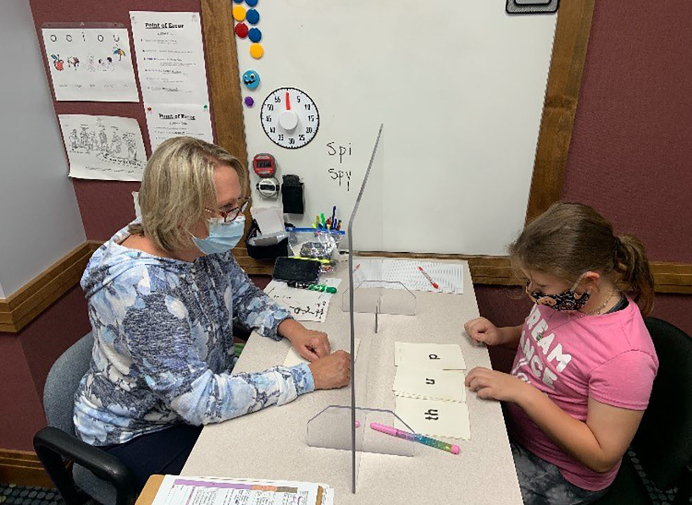Sharon Steele (Left), a tutor with the Dyslexia Center of Dayton, works with her student McKenna. The center has the capacity to help 25 children annually and offers lessons and tutor training free of charge to those who qualify. CONTRIBUTED