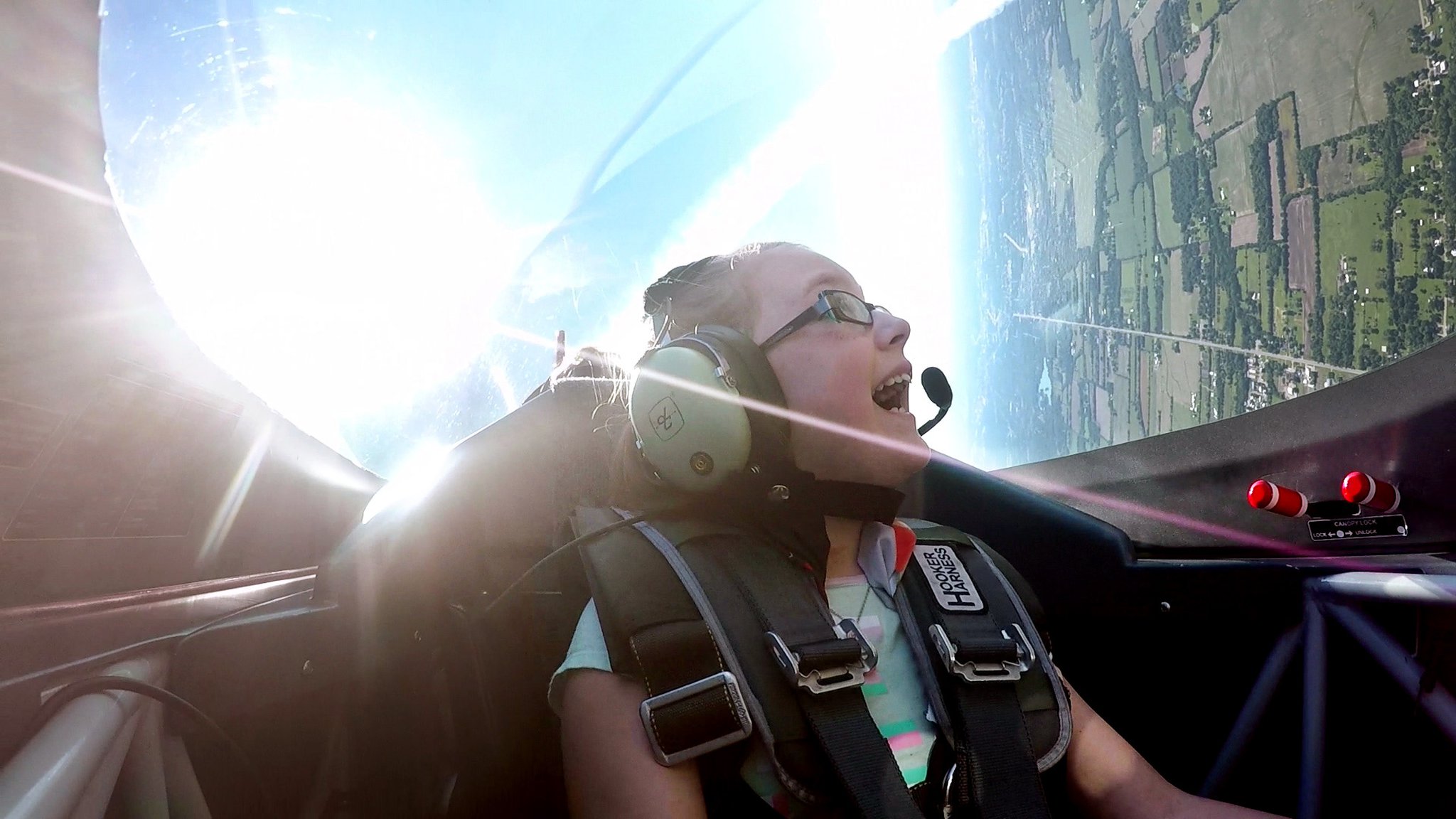 Olivia Collins, 12, was all smiles when air show legend Sean D. Tucker took her for her first airplane at the Dayton International Airport on Friday. Collins won the Young Eagles essay contest for the Dayton Air Show to earn this opportunity. The Young Eagles program was started by the Experimental Aircraft Association to expose young people to aviation through flight at their local EAA chapters. Tucker is currently chairman of Young Eagles program. SUBMITTED