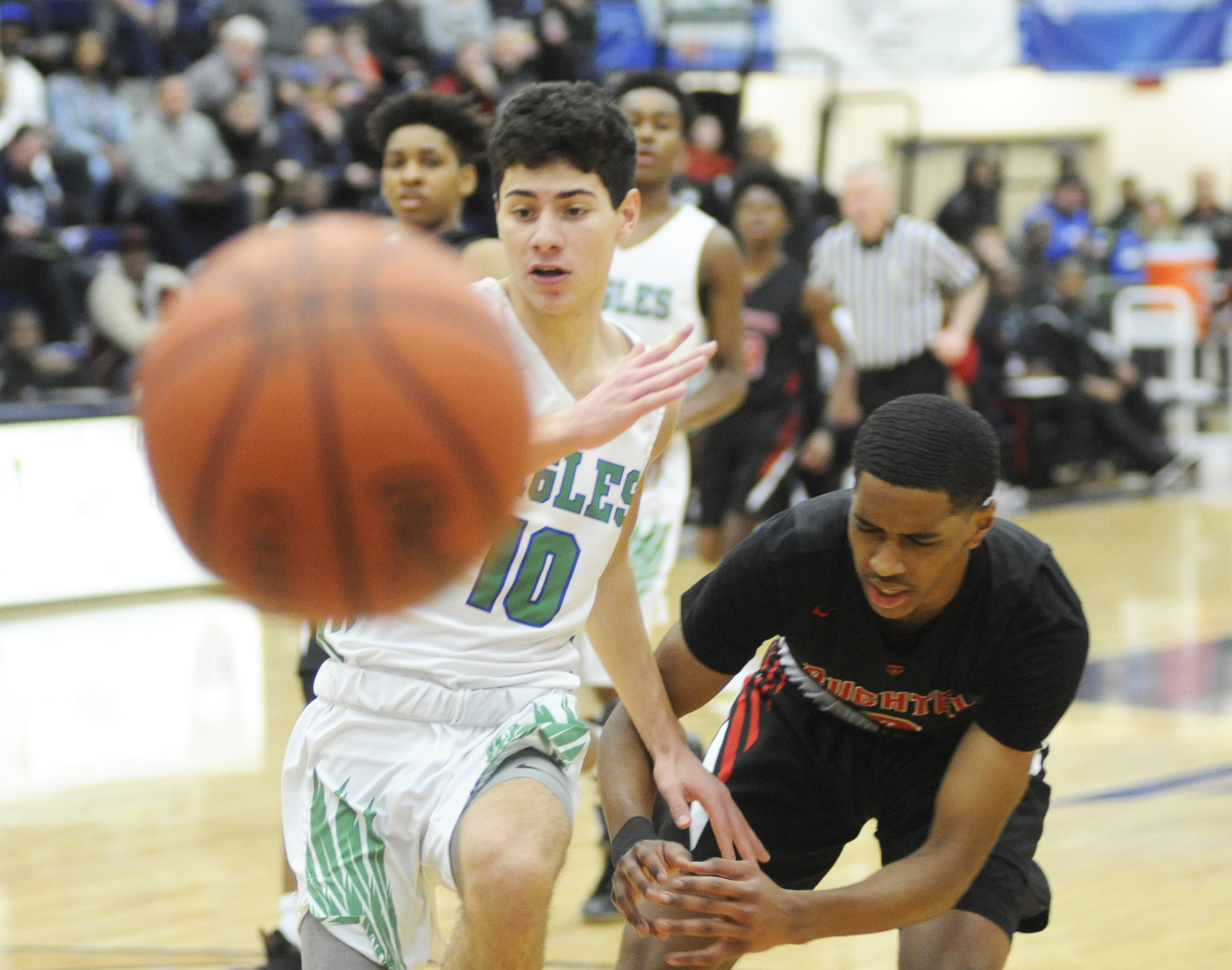CJ’s John Nauseef (left) goes for a loose ball. MARC PENDLETON / STAFF