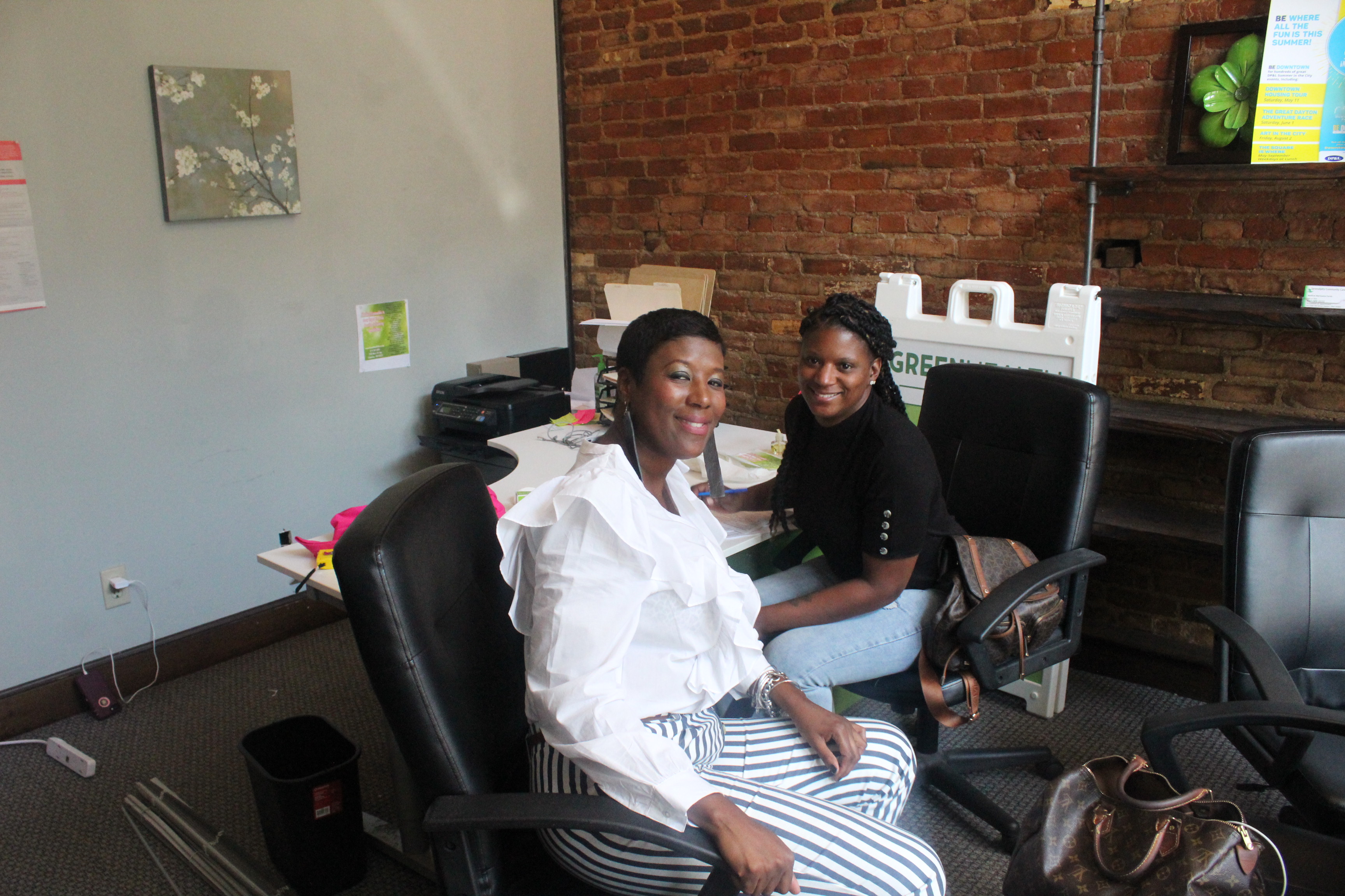 The Oregon District continues to recover from Sunday's morning mass shooting. Pictured: Shondale Atkinson (black top) of Serendipity Community Care and Denise Henton of Single Parents Rock.