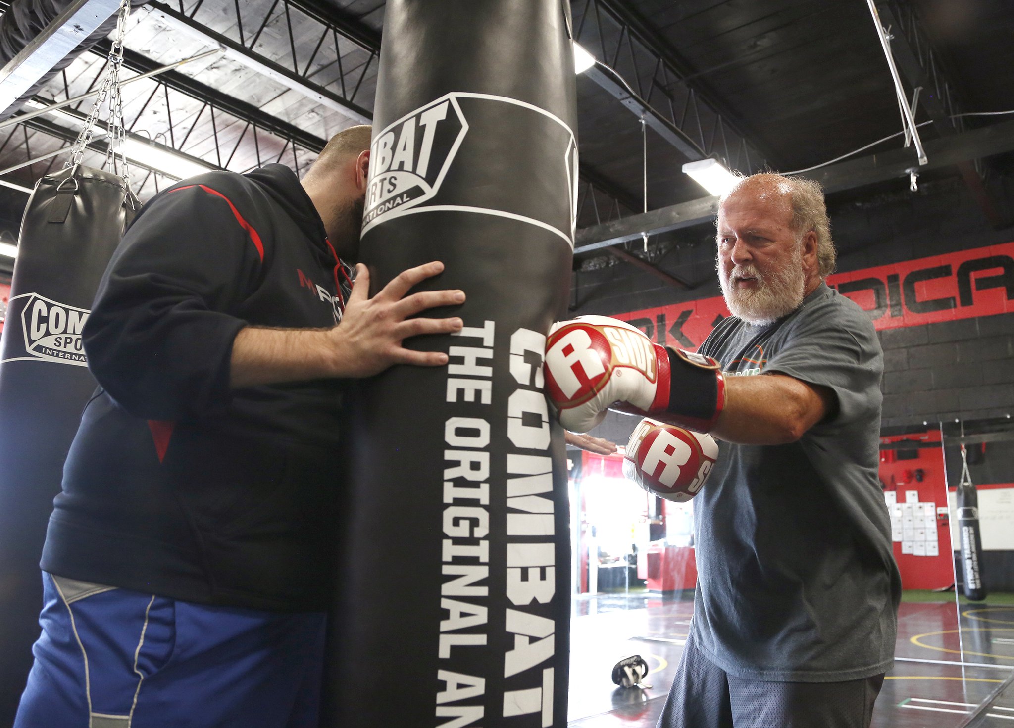 John Stanley of Vandalia works out at M-Power Gym in Vandalia. Stanley, a teacher at Northmont High School, has Parkinson’s disease and says his condition is improving with non-contact boxing workouts. LISA POWELL / STAFF