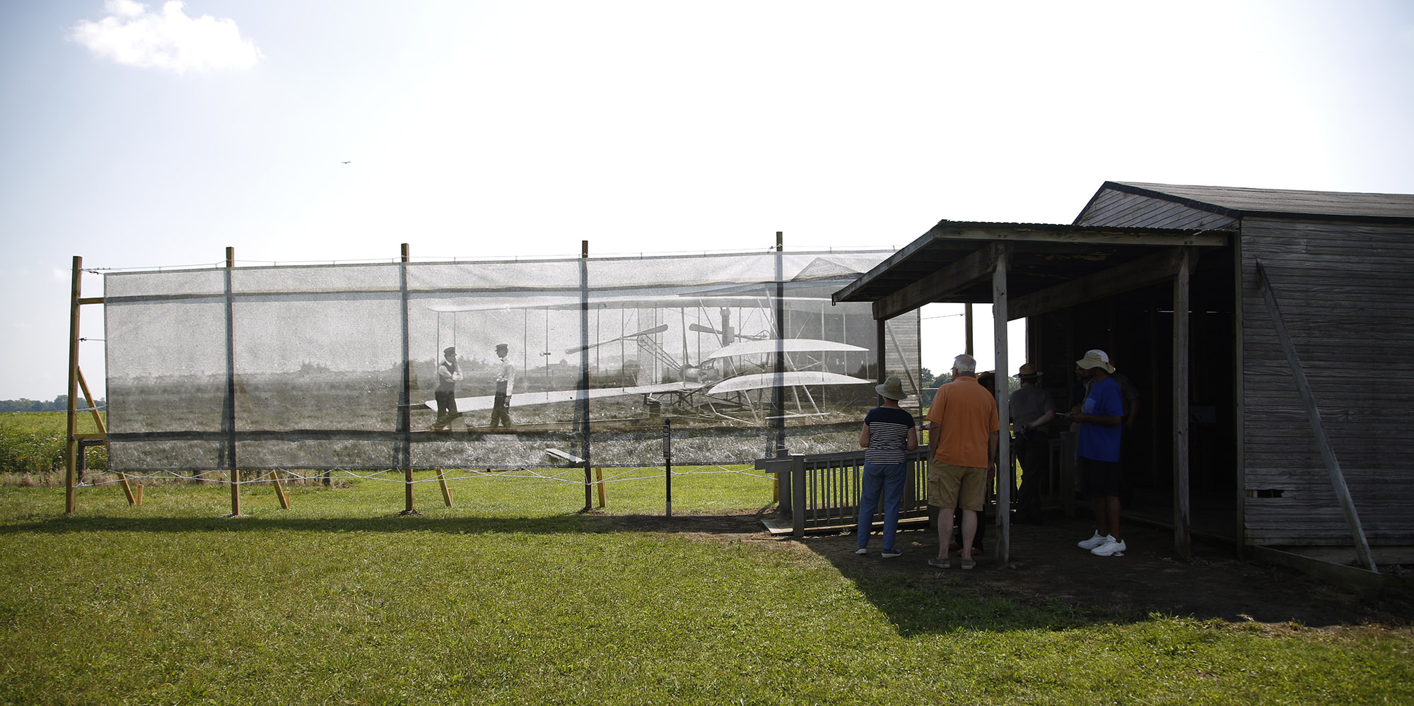 Dan Patterson, Artist in Residence with the Dayton Aviation Heritage National Historical Park had a 1904 image of the Wright Brothers on Huffman Prairie printed on mesh for display on the site of the original photo. TY GREENLEES / STAFF