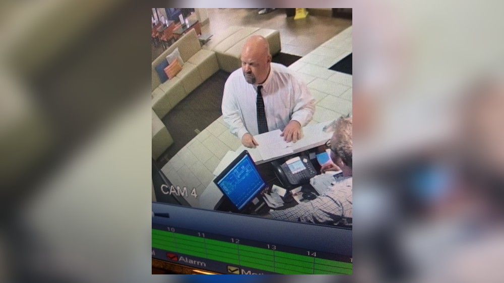 Photos exclusively obtained by News Center 7 show Justin Smith checking into a Lexington, Kentucky hotel.