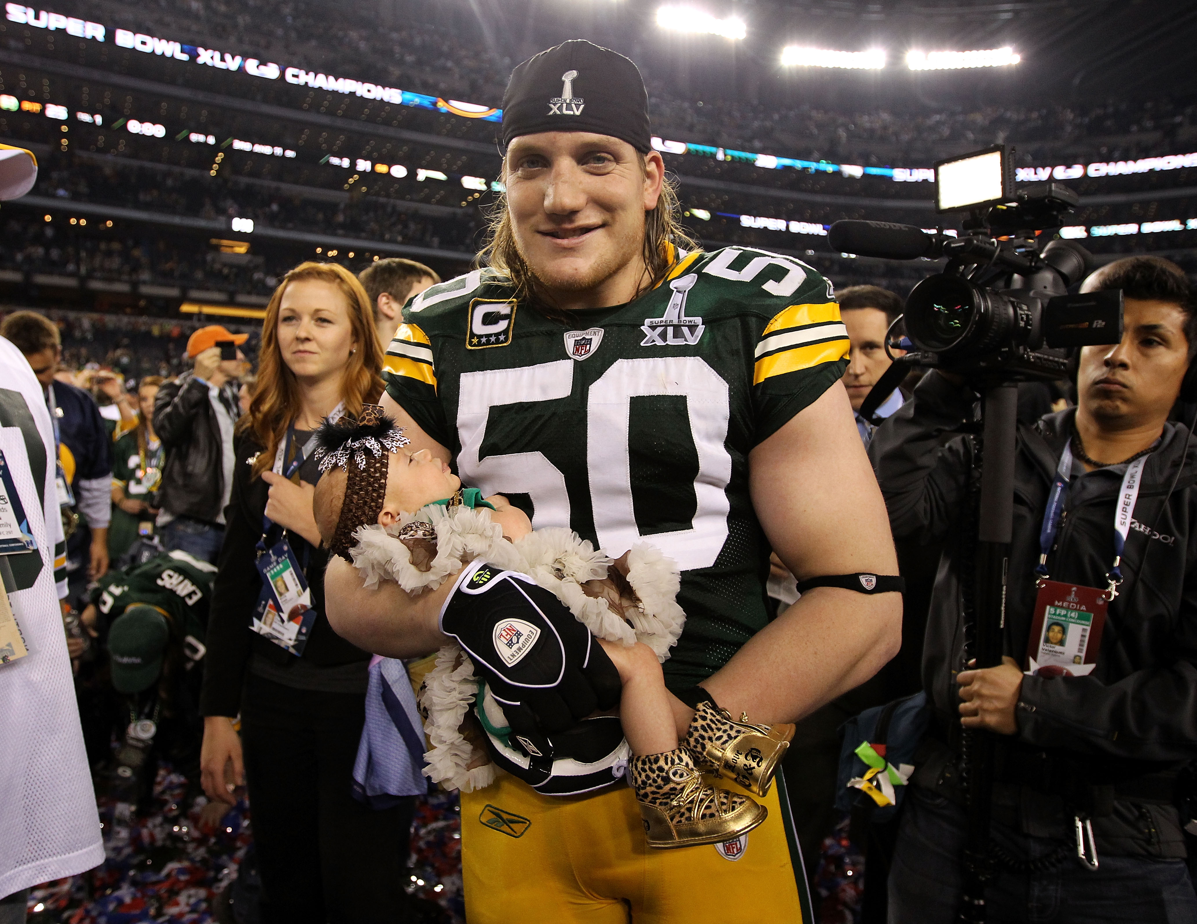 A.J. Hawk celebrated the Packers' Super Bowl win with his baby daughter Lennon after winning Super Bowl XLV 31-25 against the Pittsburgh Steelers at Cowboys Stadium on February 6, 2011 in Arlington, Texas. (Photo by Al Bello/Getty Images)