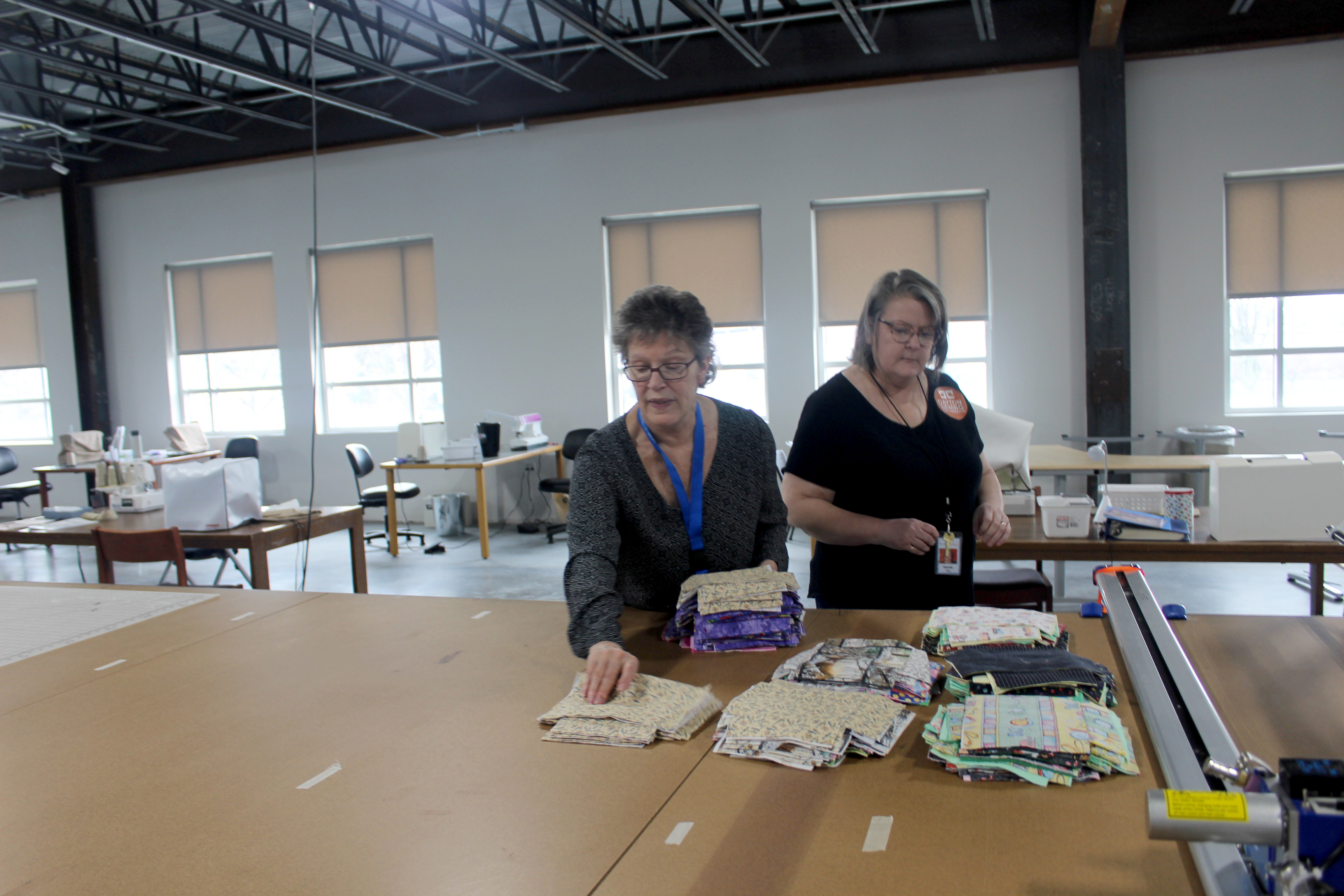 Since Friday, March 20, Dayton Sewing Collaborative volunteers in homes around the community have made hundreds of reusable face mask for local organization who need them as worries mount of the coronavirus. Volunteers Bonnie Craigo (left) is pictured with director Brenda Rex.