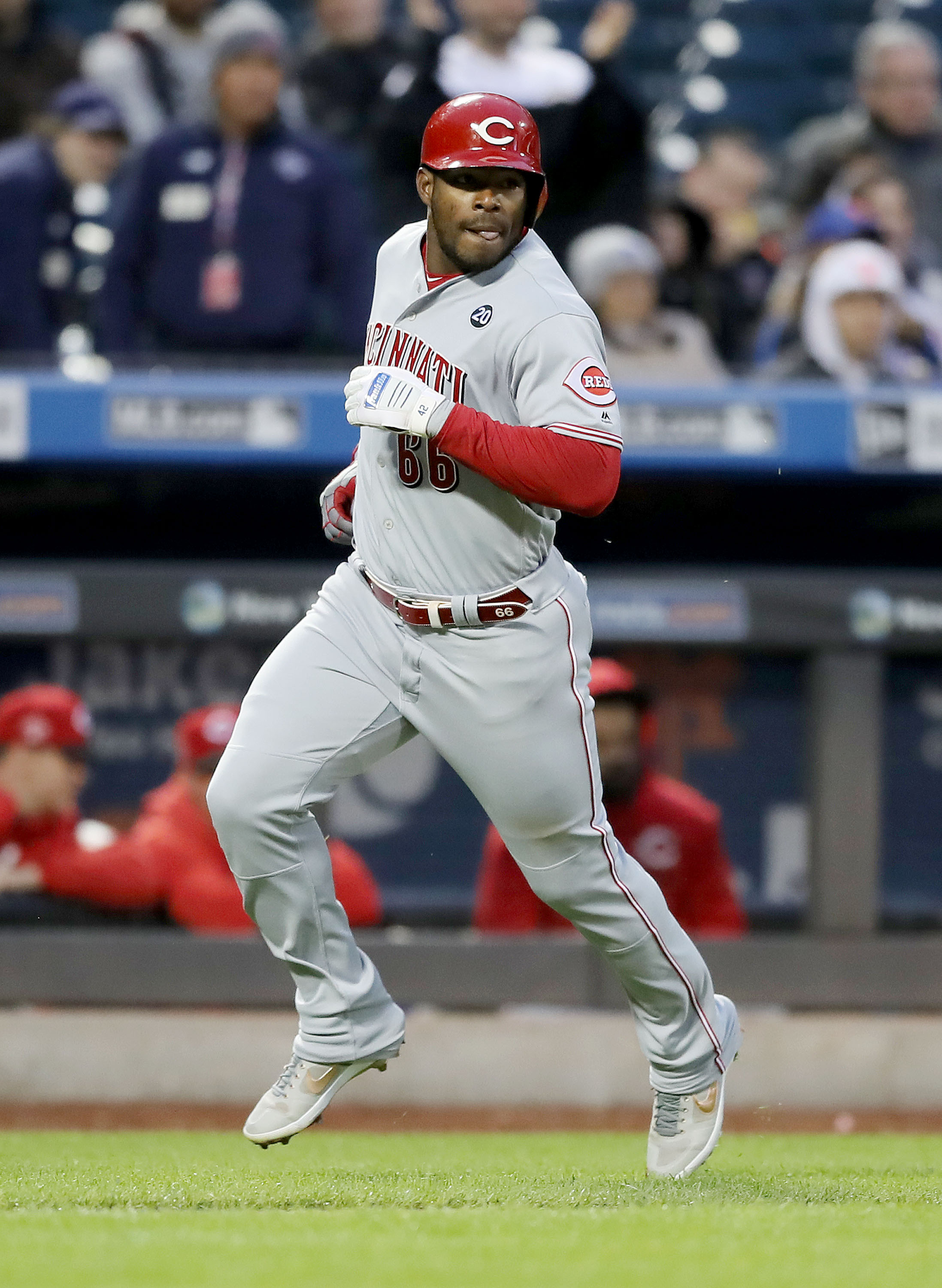 NEW YORK, NEW YORK - APRIL 29: Yasiel Puig #66 of the Cincinnati Reds scores on an RBI double from teammate Jose Iglesias in the second inning against the New York Mets at Citi Field on April 29, 2019 in the Flushing neighborhood of the Queens borough of New York City. (Photo by Elsa/Getty Images)