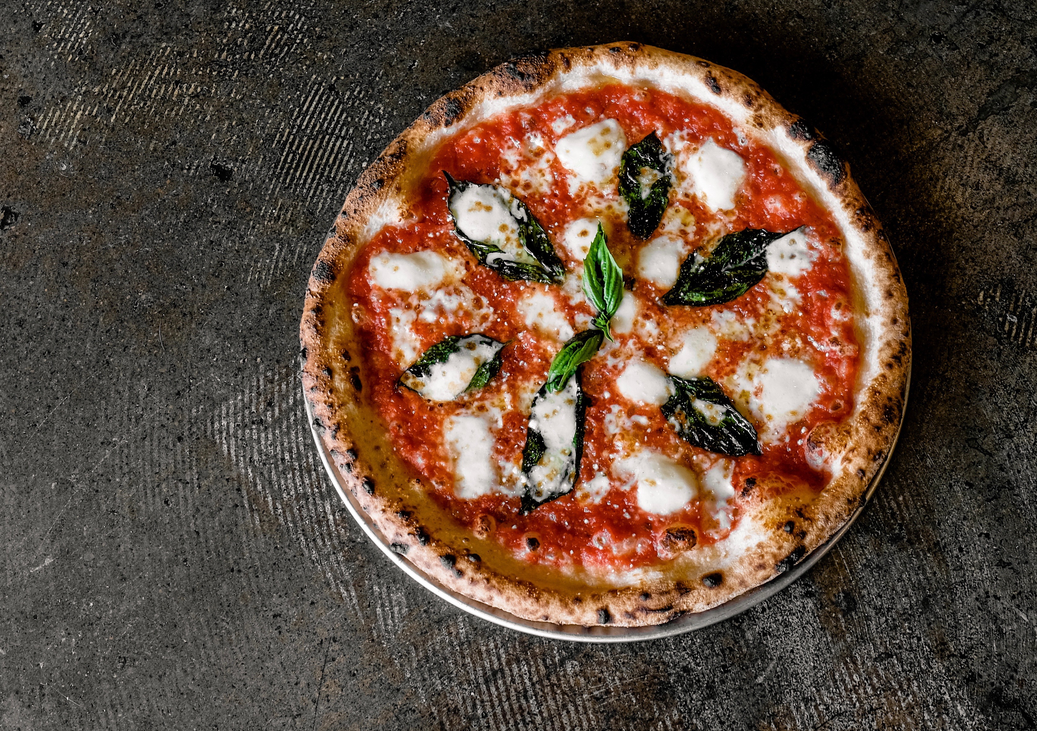Independent and locally owned Old Scratch Pizza serves Naples-style pizzas cooked in wood-fired ovens, as well as salads and a few specialty items. It features a variety of craft beers on tap as well as a wine and cocktail list. CONTRIBUTED