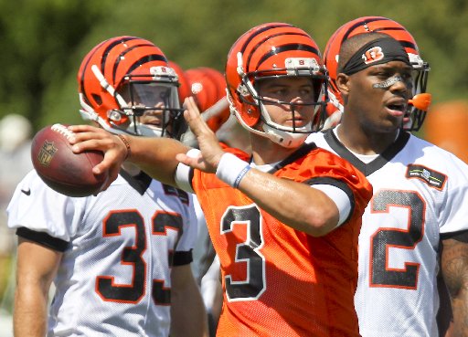 Bengals quarterback Keith Wenning (3) makes a throw during the opening day of Bengals training camp, Friday, July 31, 2015. GREG LYNCH / STAFF