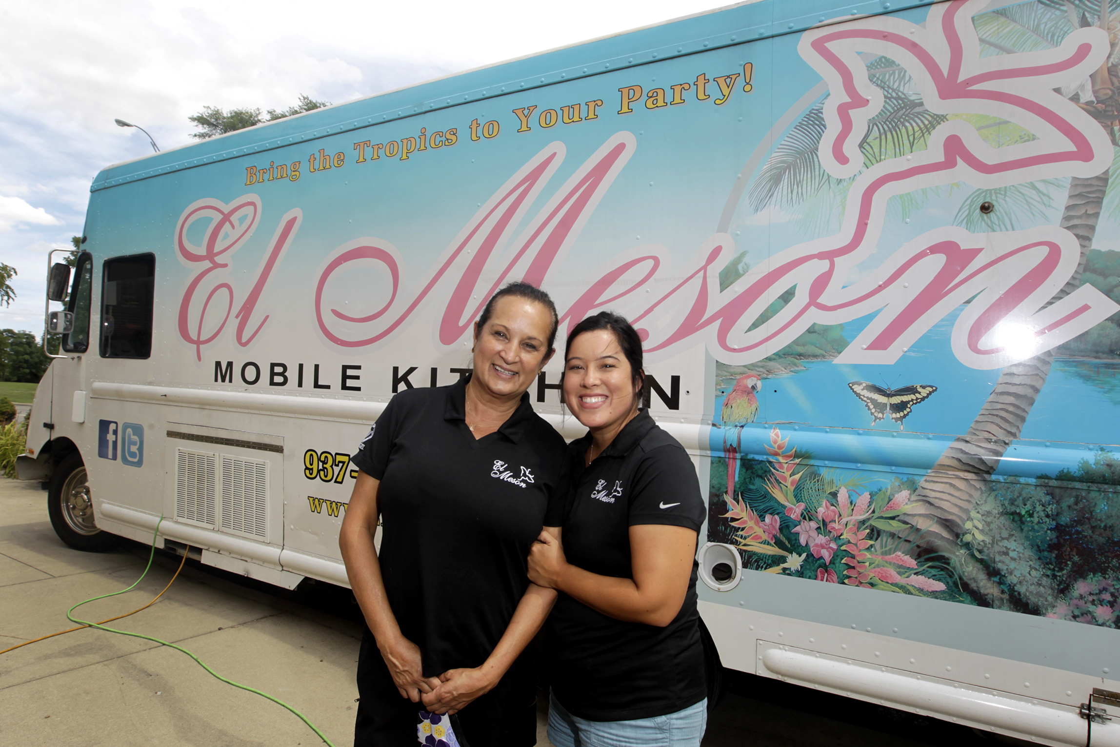 Marie Castro (left) and her daughter, Tatiana Lamley, run the El Meson food trucks. The restaurant, founded by Marie's parents, Herman and Gloria Castro, has six food trucks in its fleet. LISA POWELL / STAFF