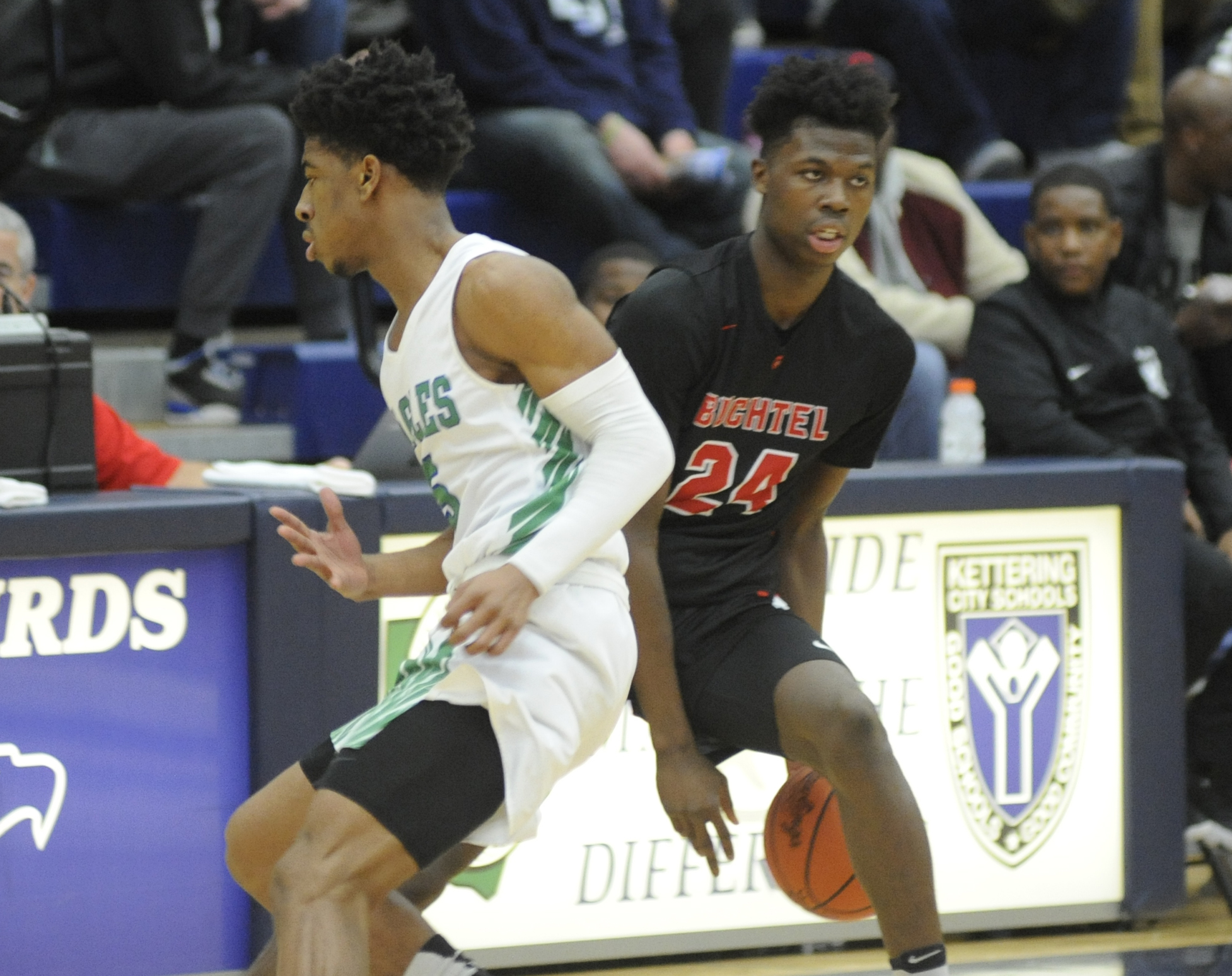 Buchtel’s Chris Livington (with ball) is checked by CJ’s Dominic Wilcox. MARC PENDLETON / STAFF