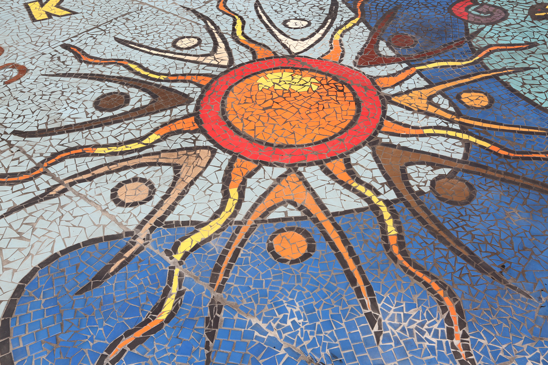 "Together We Rise," is a new large-scale play area and work of art in West Dayton. The in-ground mosaic is a play station designed with interactive games, alphabet letters and raised areas for crayon rubbings. It is located in a playground at the intersection of Harvard Boulevard and Burroughs Drive on the Omega CDC Harvard Campus. LISA POWELL / STAFF