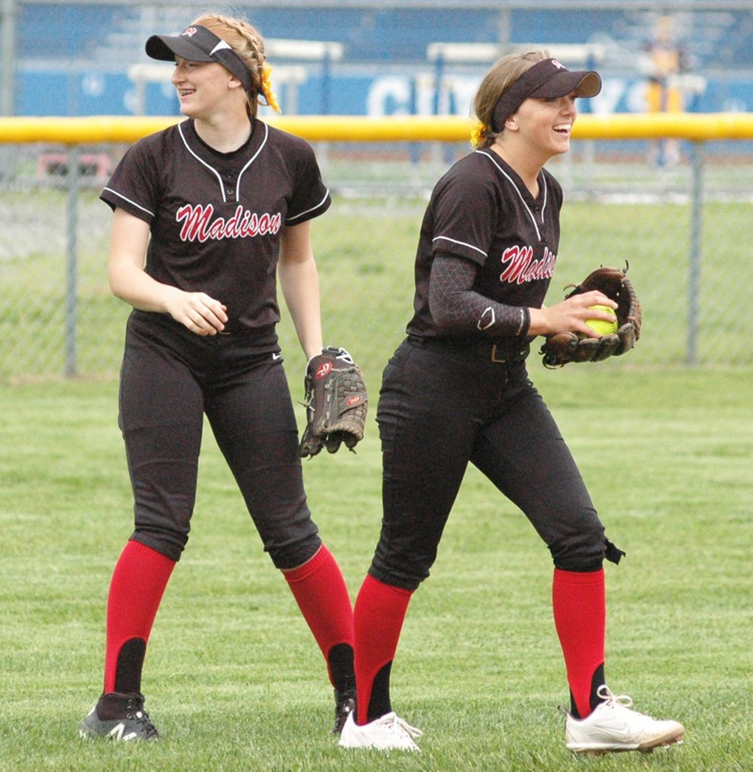 Madison’s Ally King (left) and Jenna O’Hair react to an out May 13 during a Division III district softball semifinal against Deer Park at Wyoming. Deer Park won 6-3. RICK CASSANO/STAFF