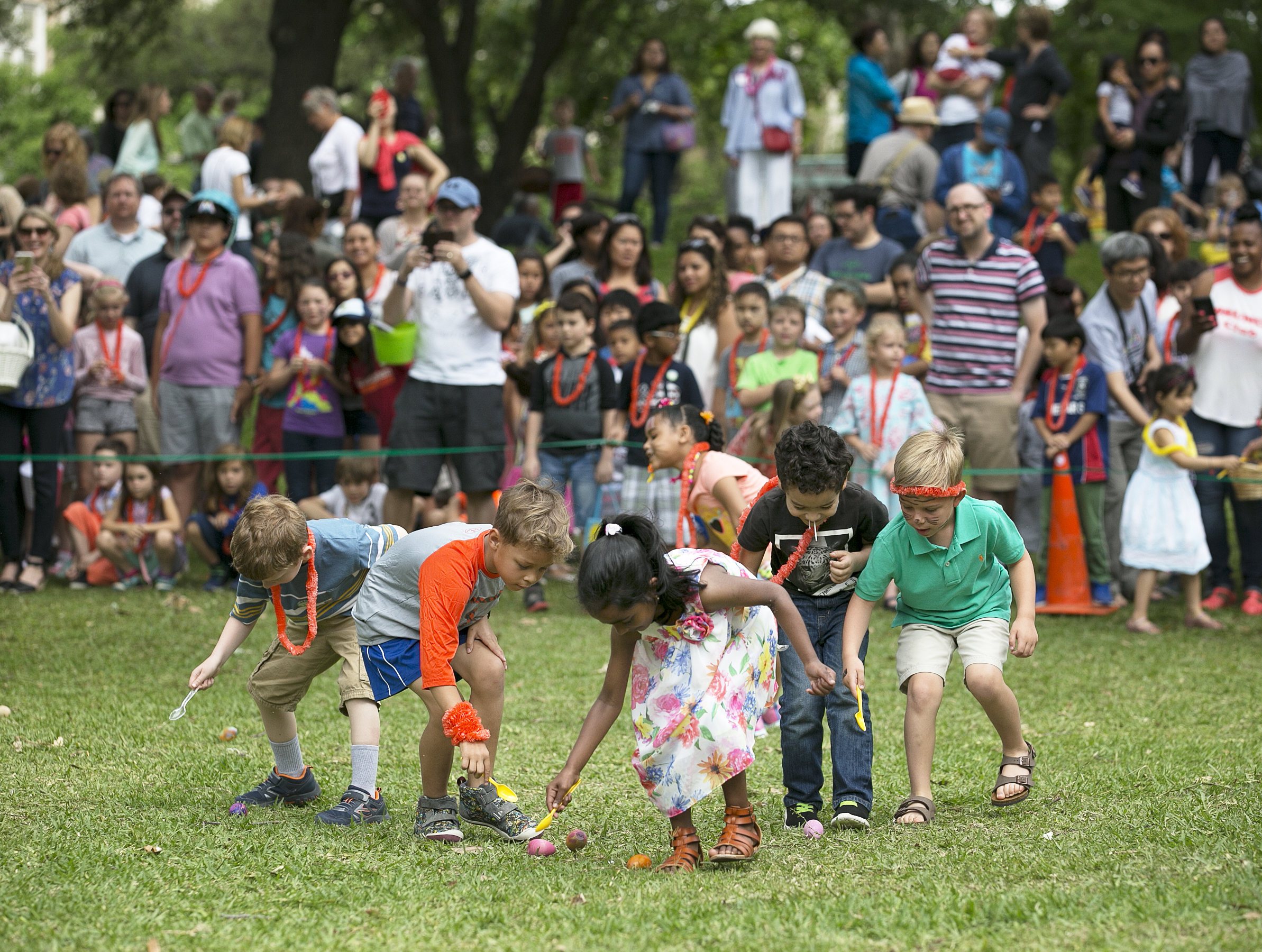 A group of children do their best to move an egg with a spoon during the egg roll at the First United Methodist Church's annual Easter egg hunt on the grounds of the state Capitol on Saturday, April 15, 2017. Food was sold at the event with proceeds supporting First UMC's Eurasia Mission Team, and non-perishable food donations were taken for the Capital Area Food Bank. DEBORAH CANNON / AMERICAN-STATESMAN
