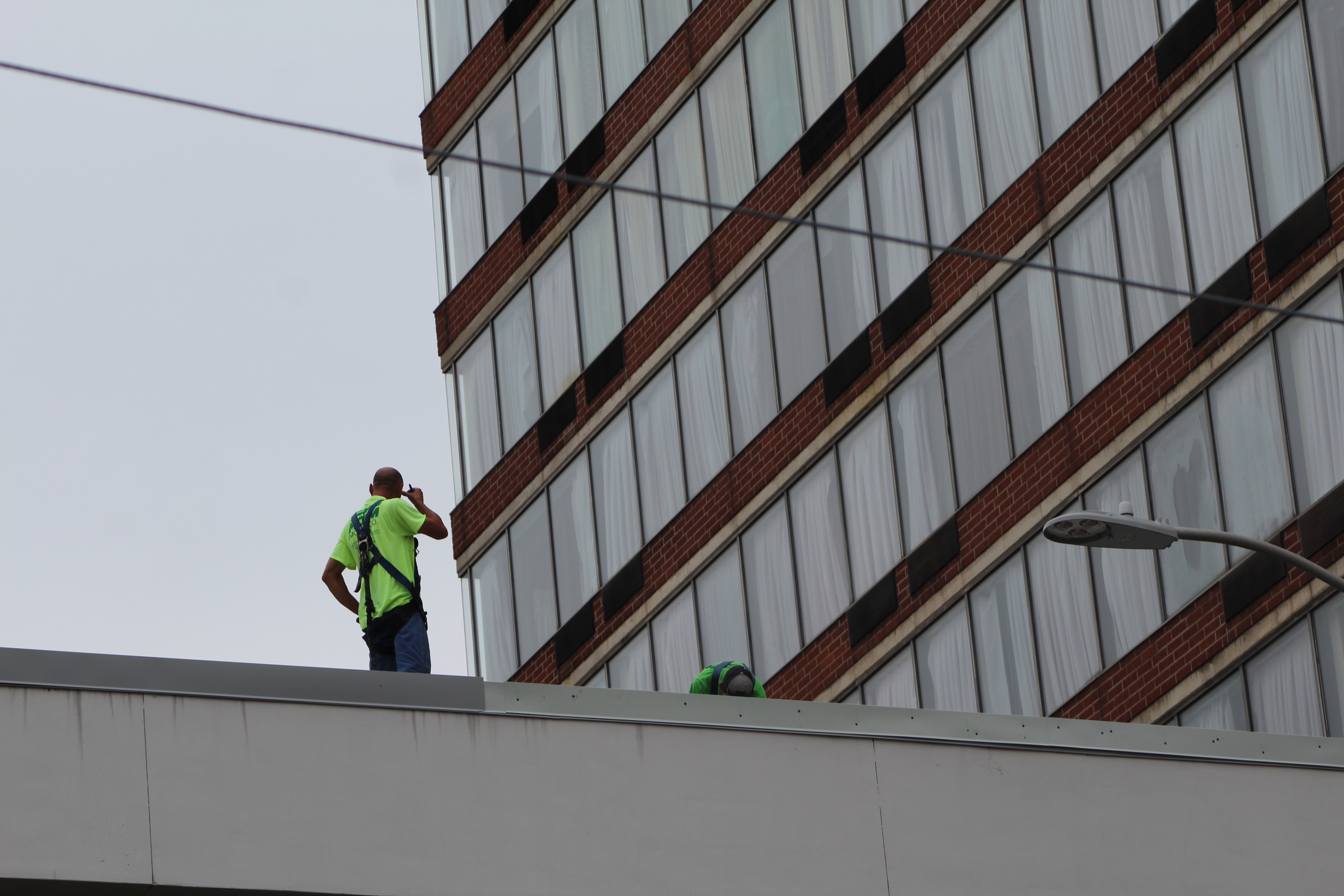 Crews work on the skywalk leading from the Dayton Convention Center to the hotel across the street and the parking garage. CORNELIUS FROLIK / STAFF
