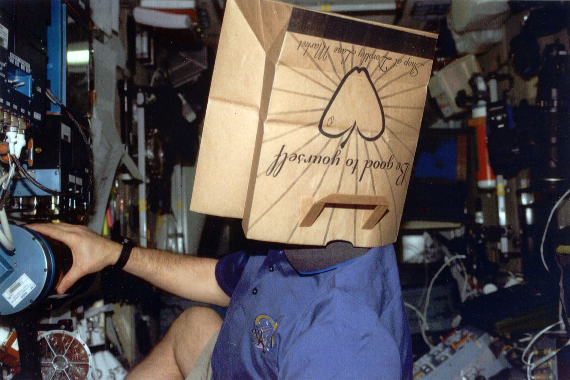 Air Force Col. Gregory Johnson, astronaut from Fairborn who recently piloted the space shuttle wearing a Dorothy Lane Market bag on his head