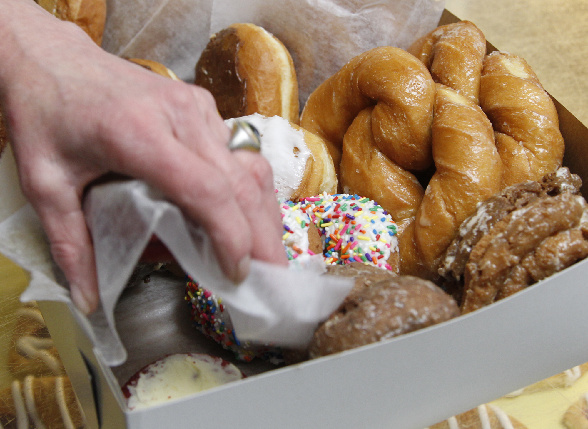 Bill's Donut Shop order ready in the box on Wednesday, February 27, 2013 in Centerville. TY GREENLEES / STAFF