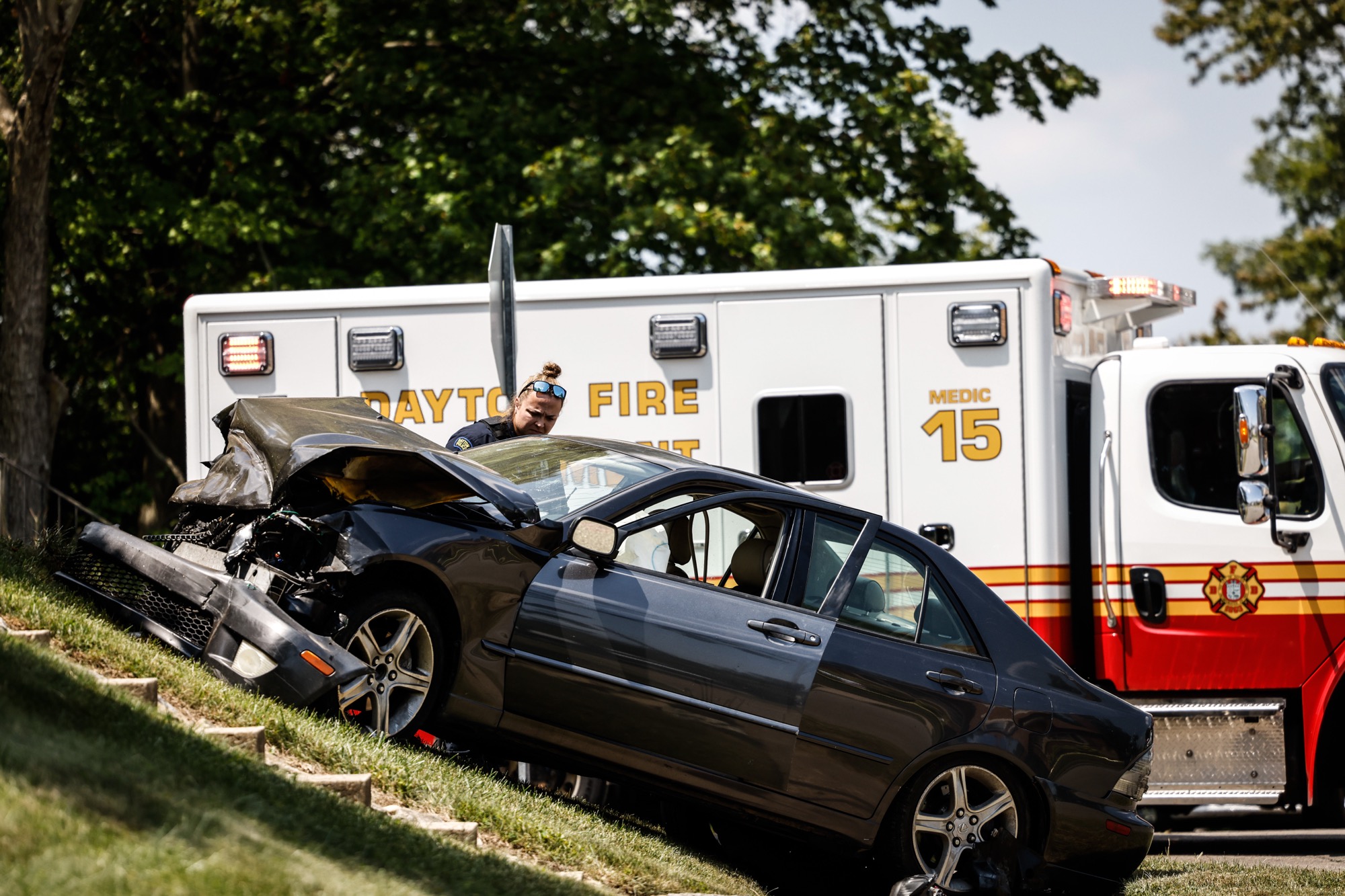 The driver of a gray Lexus fled a traffic stop and then intentionally rammed a Dayton officer's cruiser, which led to a police pursuit in east Dayton that ended in a crash at the intersection of Murray Drive and East Fourth Street when the suspect car collided with a silver car that struck a U.S. Postal Service van.. The suspect ran but was caught by officers a couple blocks away and is in custody. Jim Noelker/Staff
