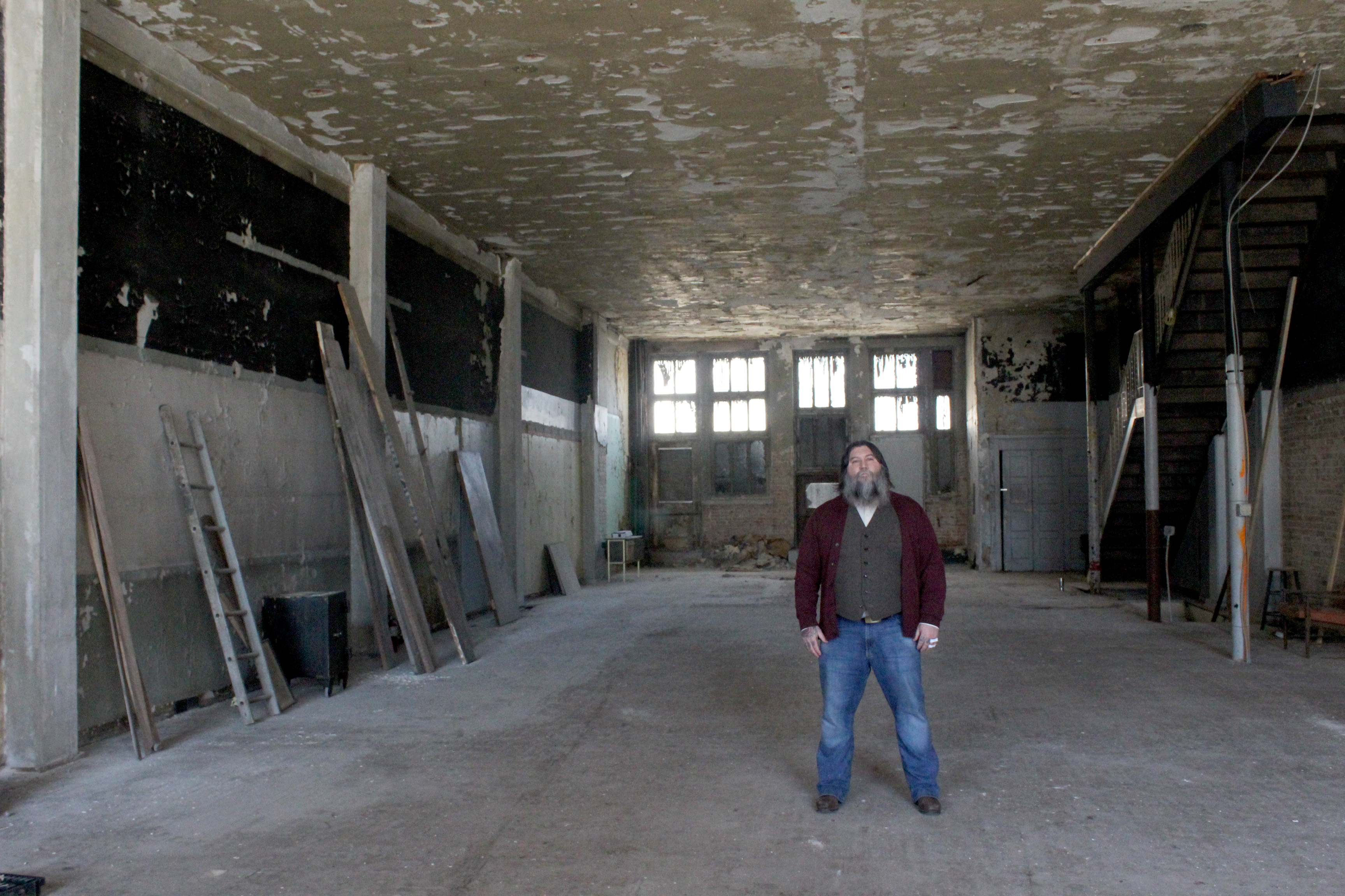 The Century Bar is moving from 10 Jefferson Street, next door to 18 to 20 S. Jefferson St, the former Dayton Power and Light Building. Co-owner Joe Head is pictured on the building's first floor of the old DP&L building.