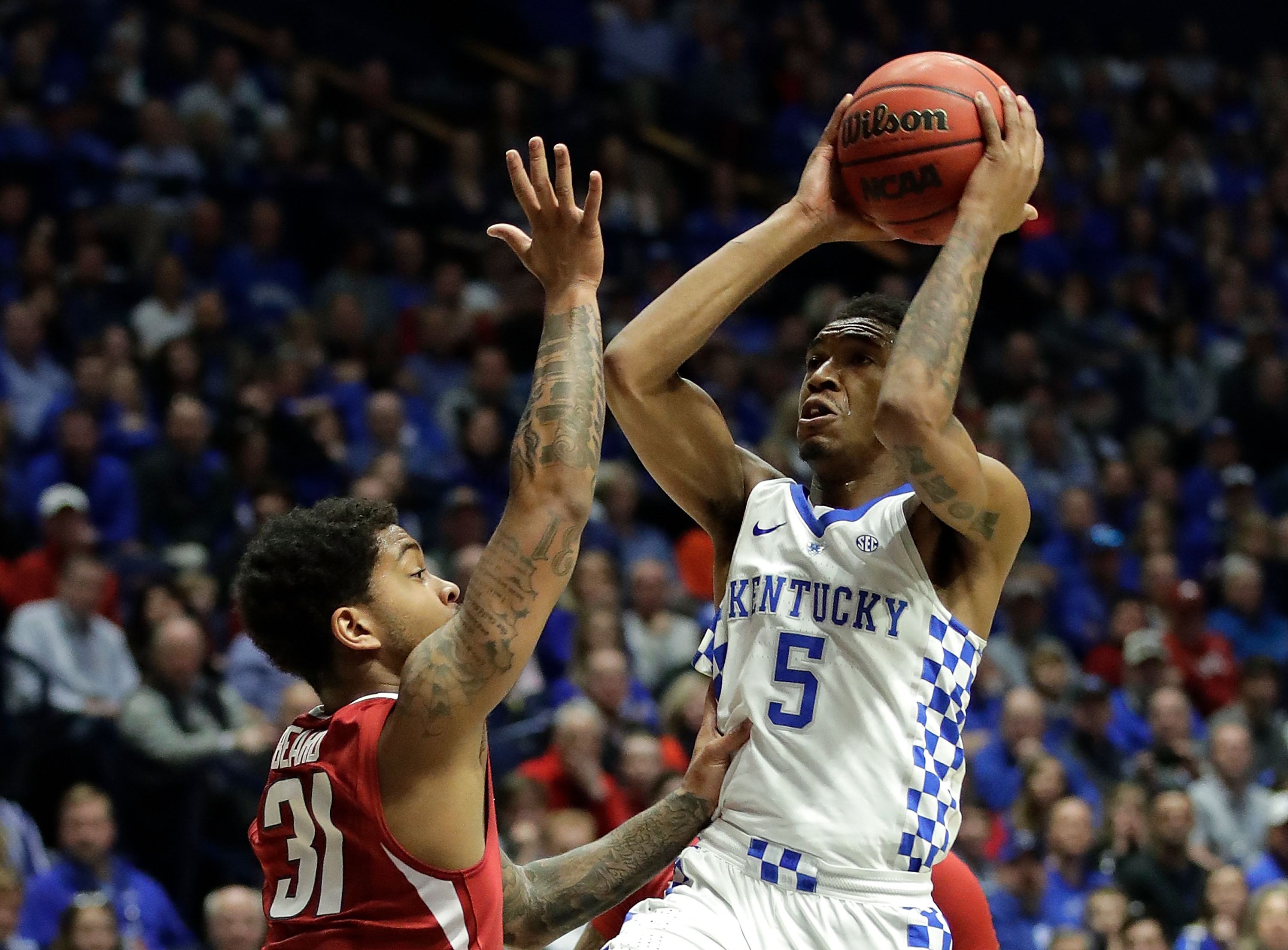 NASHVILLE, TN - MARCH 12: Malik Monk #5 of the Kentucky Wildcats drives against Anton Beard #31 of the Arkansas Razorbacks during the championship game at the 2017 Men’s SEC Basketball Tournament at Bridgestone Arena on March 12, 2017 in Nashville, Tennessee. (Photo by Andy Lyons/Getty Images)