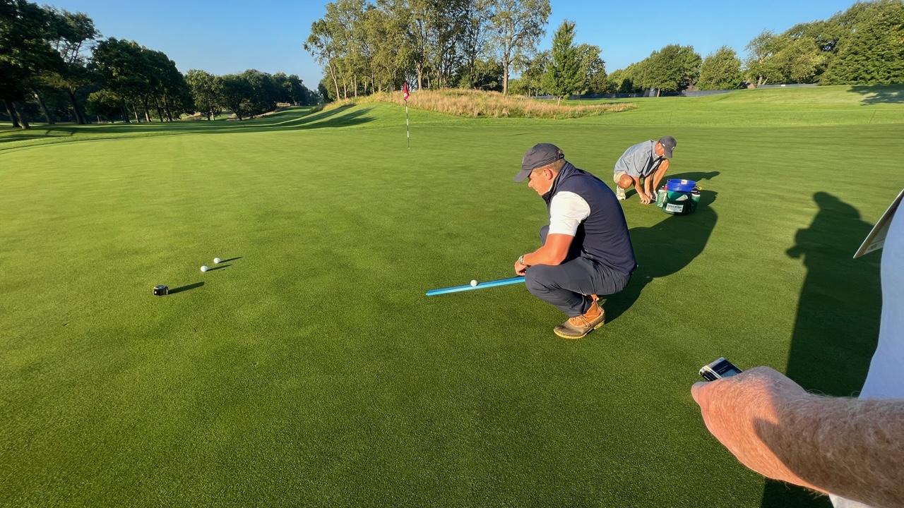 USGA agronomist Paul Jacobs uses a stimmeter to determine the speed and consistency of the ninth green on the NCR South Course early Saturday morning before the start of round three of the US Senior Women's Open Championship.  Jim Campion/CONTRIBUTED