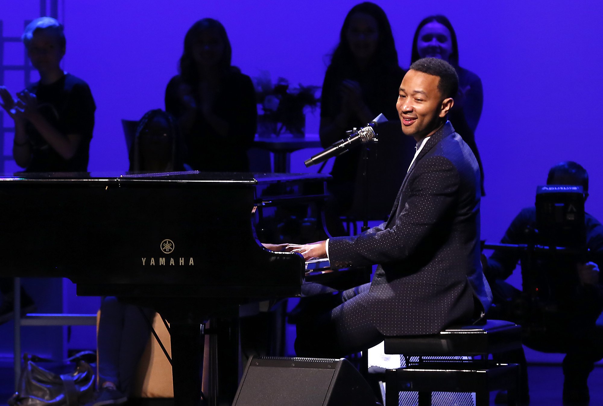 John Legend performs on stage during a concert following the ribbon cutting for the new John Legend Theater Sunday. Bill Lackey/Staff