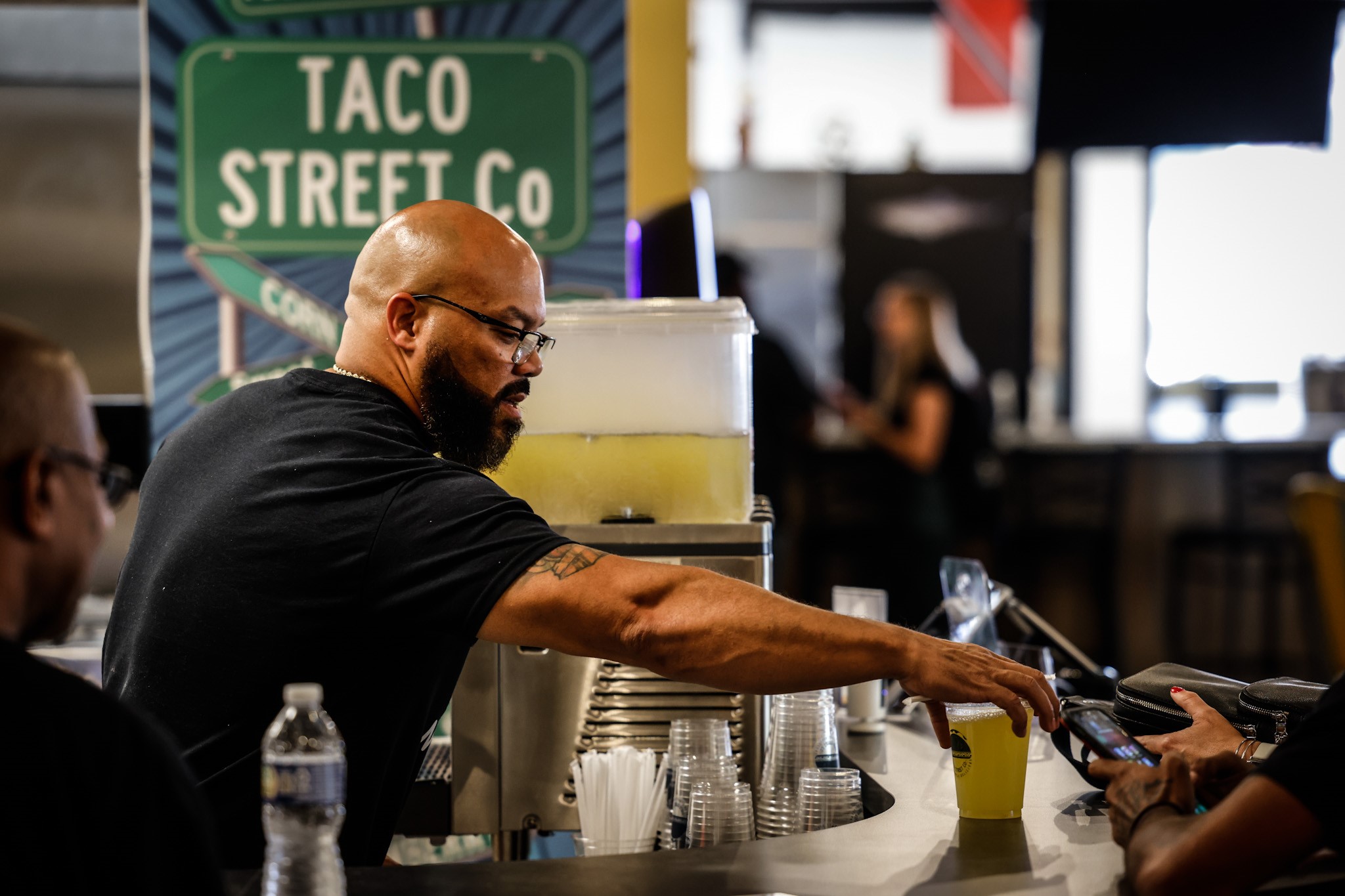 Taco Street Co. owner, Anthony Thomas fixes drinks at his store inside West Social Tap and Table at 1100 West Third St. The food hall features six local restaurants and a bar and plans to open July 25, 2022. JIM NOELKER/STAFF