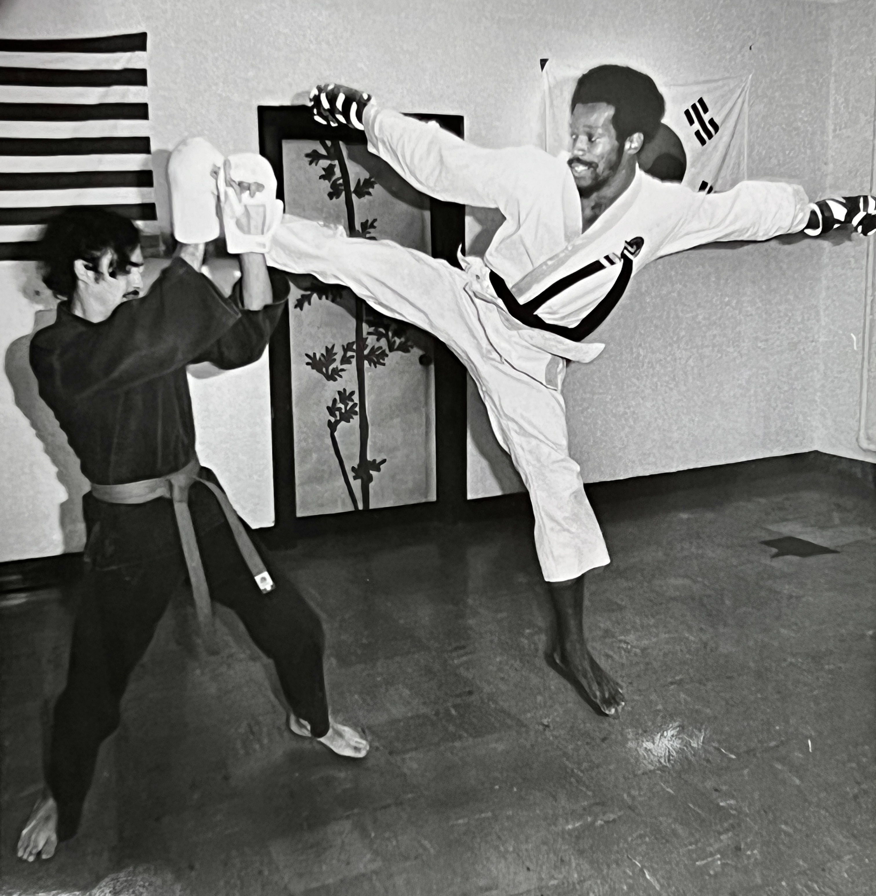 Lifelong Hamilton resident Bob “Moo Duk Kwan” Harris has been teaching karate since 1969, including more than 35 years of teaching at the Hamilton YMCA and his own studio.  He has reached Supreme Nim Grand Master status in karate and and is a two-time national champion.  Harris operates his photography business and Moo Duk Kwan Karate Temple at his South Second Street studio.  NICK GRAHAM/STAFF Hamilton resident Bob “Moo Duk Kwan” Harris has been teaching karate since 1969, including more than 35 years of teaching at the Hamilton YMCA and his own studio.  He has reached Supreme Nim Grand Master status in karate and and is a two-time national champion.  Harris operates his photography business and Moo Duk Kwan Karate Temple at his South Second Street studio.  Harris is pictured, right, practicing with student Darrell Croucher over 40 years ago in a Journal-News photo by John Janco.